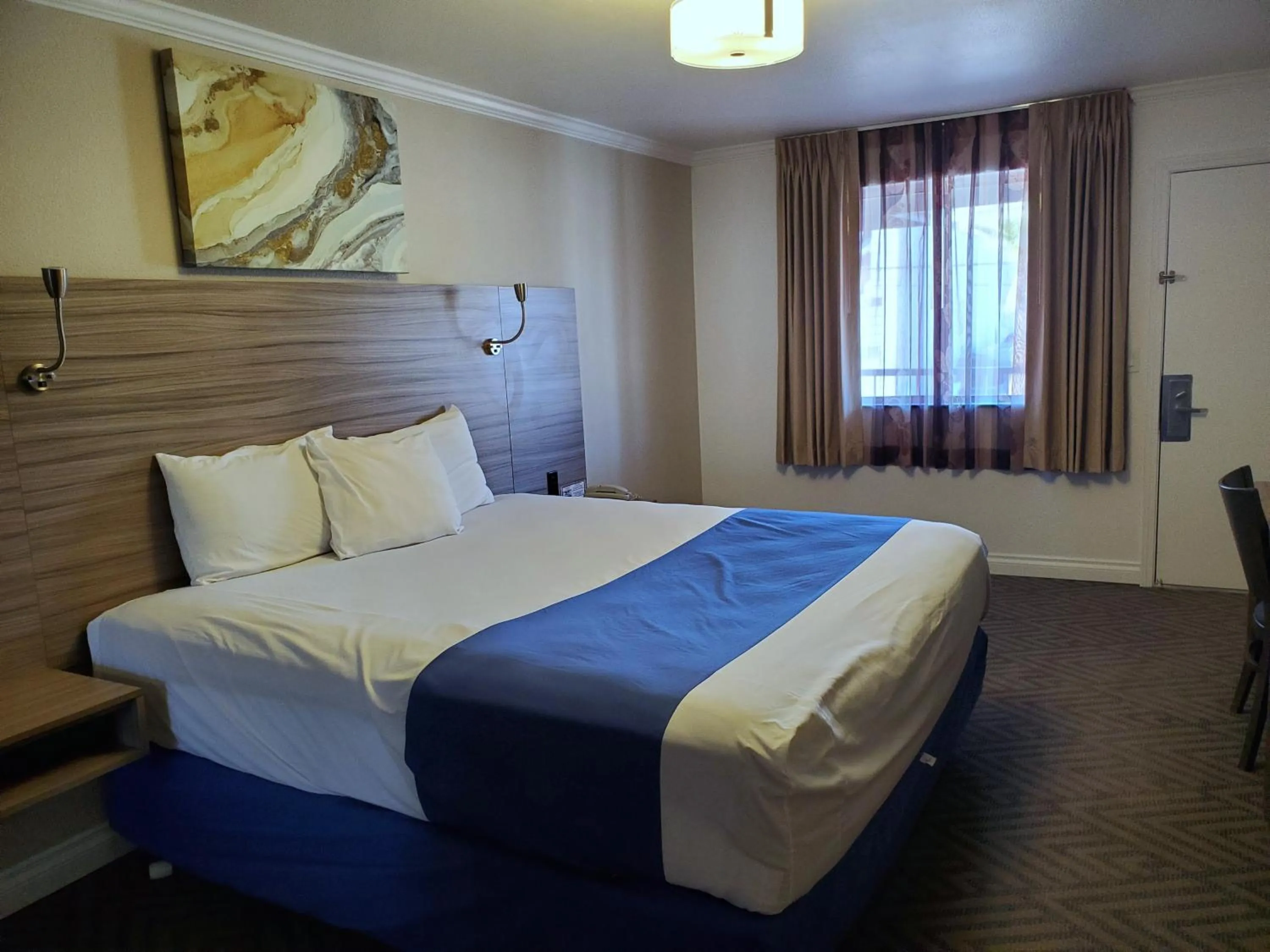 Bed in Exchange Club Motel