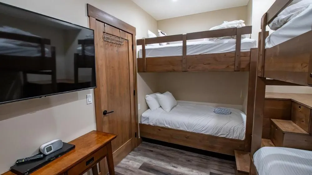 Bed in Snow Creek Cabins by Fernie Lodging Co