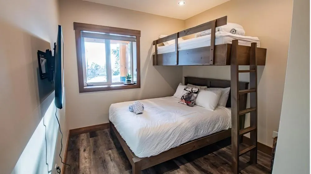 Bed in Snow Creek Cabins by Fernie Lodging Co