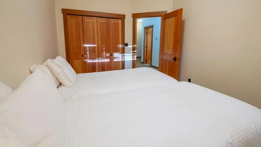 Bed in Snow Creek Cabins by Fernie Lodging Co