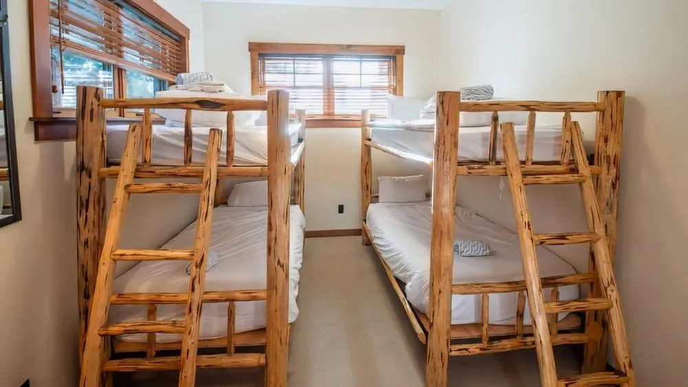 Bed in Snow Creek Cabins by Fernie Lodging Co