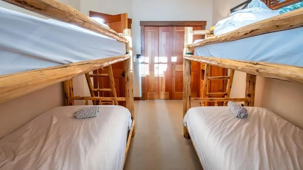 Bed in Snow Creek Cabins by Fernie Lodging Co
