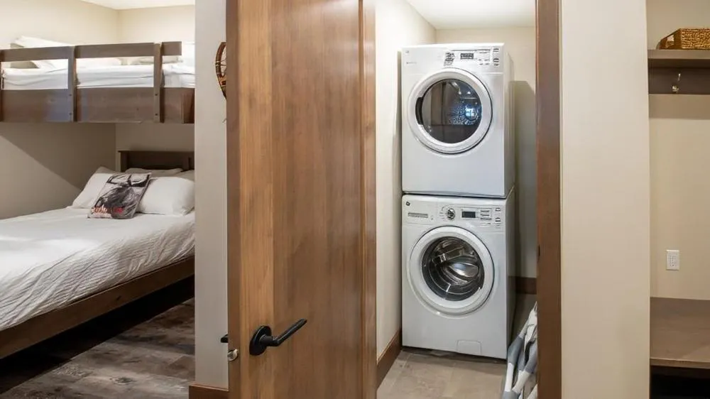 Bed in Snow Creek Cabins by Fernie Lodging Co