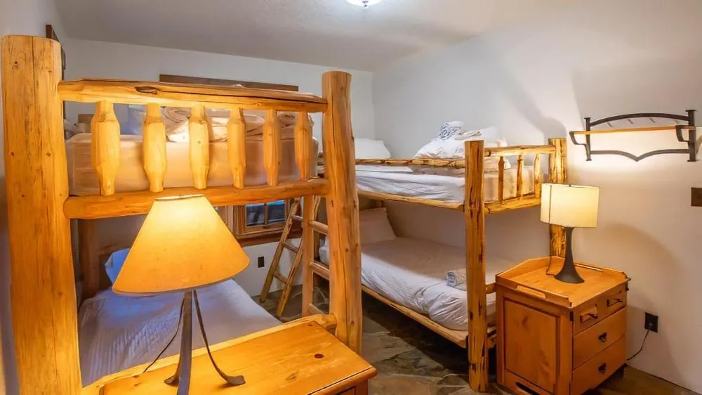 Bed in Snow Creek Cabins by Fernie Lodging Co