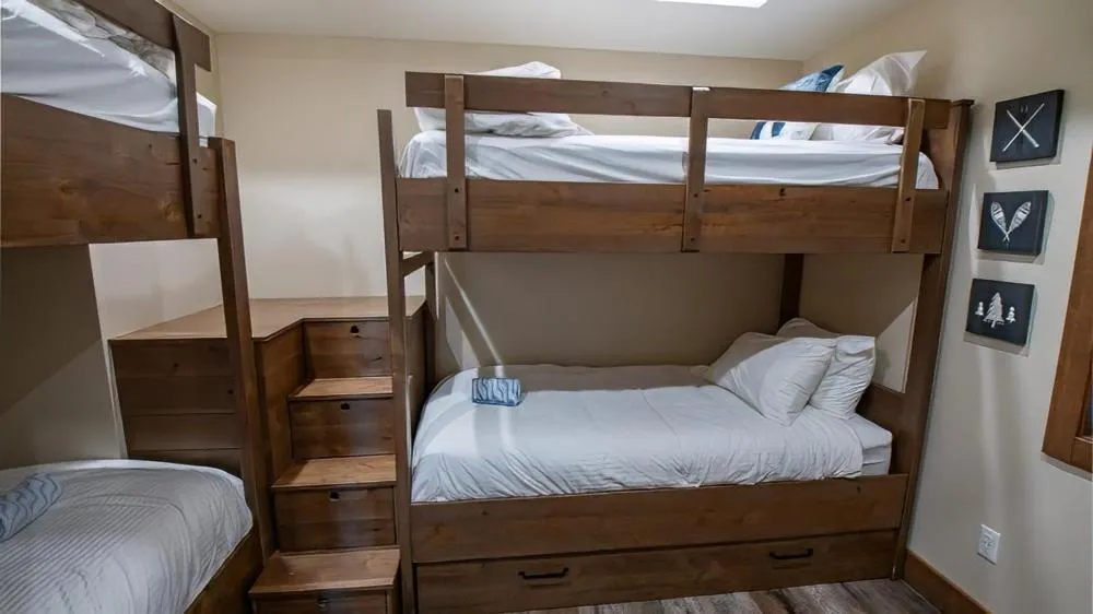 Bed in Snow Creek Cabins by Fernie Lodging Co