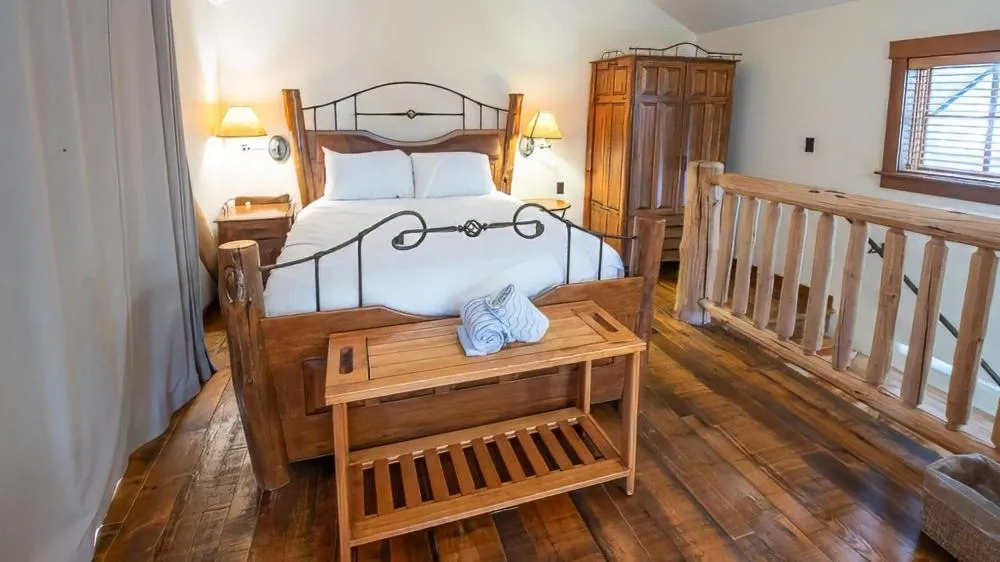 Bed in Snow Creek Cabins by Fernie Lodging Co