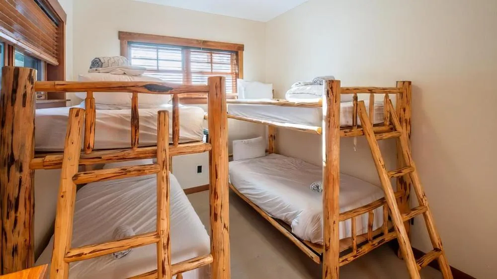 Bed in Snow Creek Cabins by Fernie Lodging Co