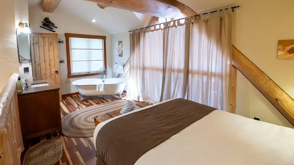 Bed in Snow Creek Cabins by Fernie Lodging Co