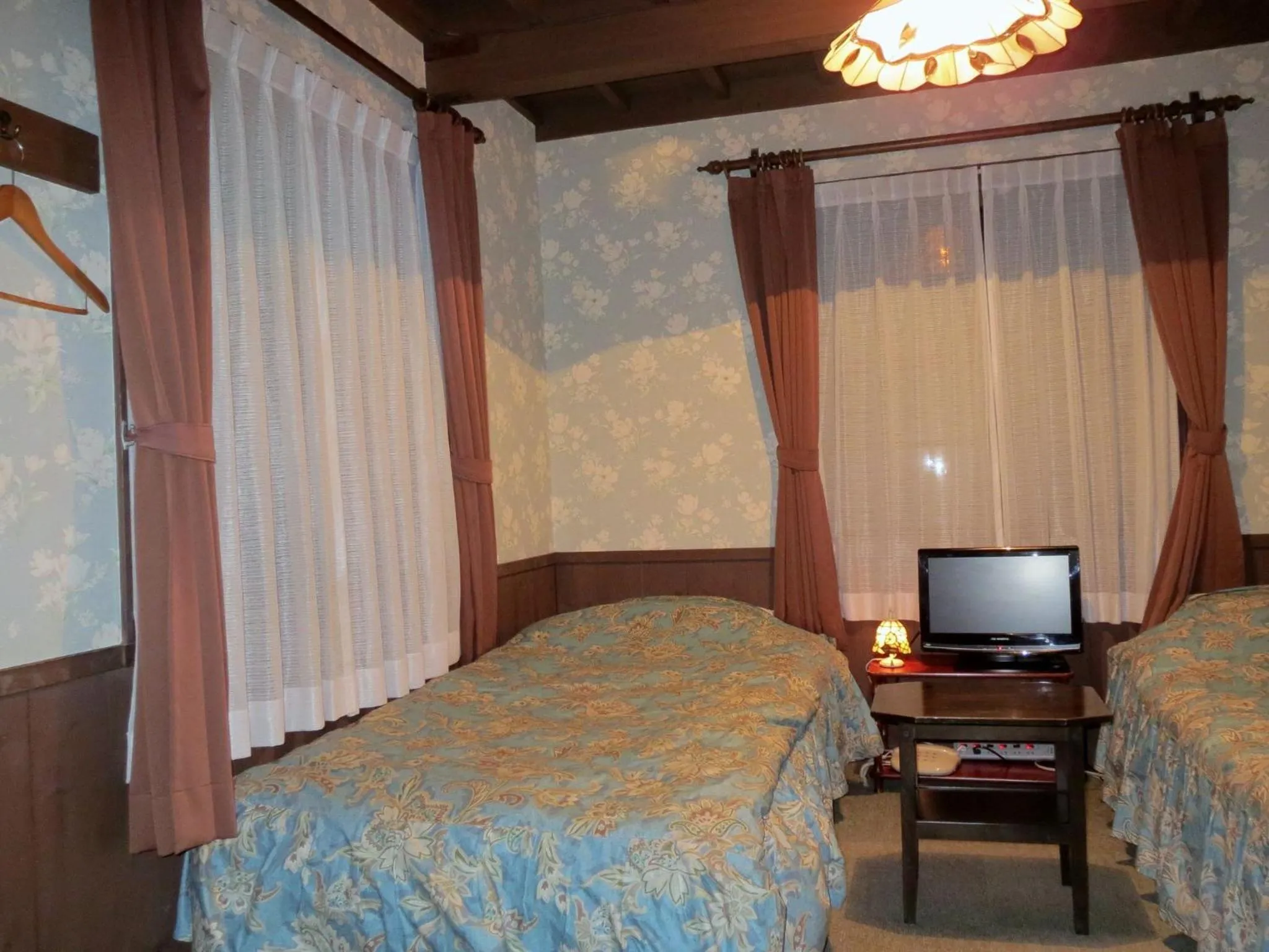 Photo of the whole room, Bed in Pension Marionette