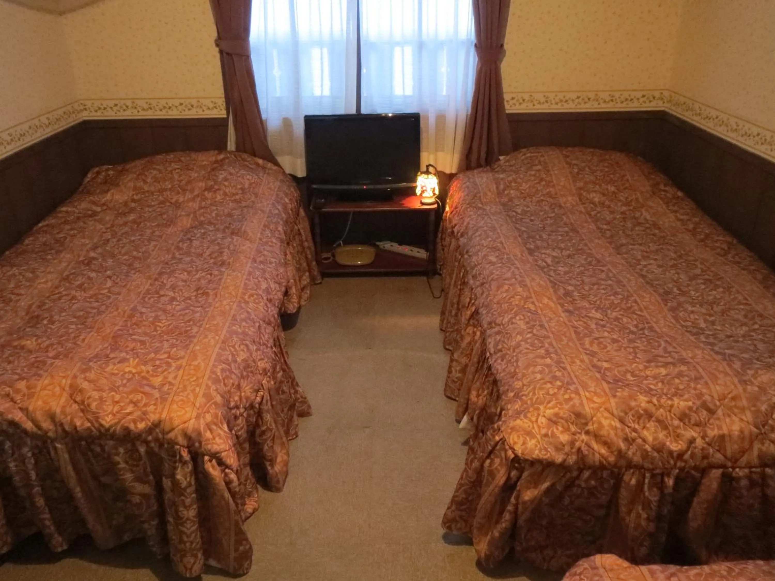 Photo of the whole room, Bed in Pension Marionette