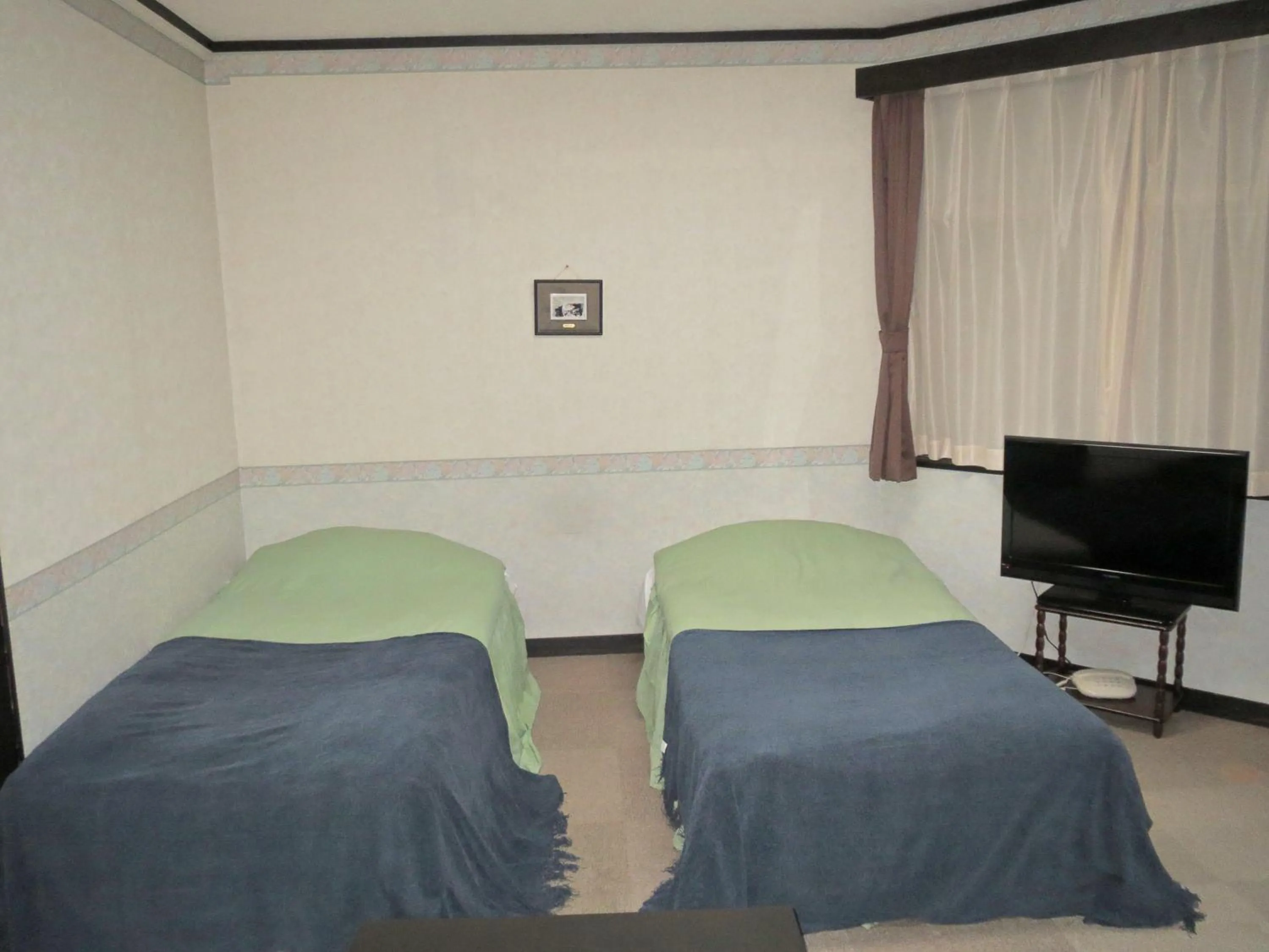 Photo of the whole room, Bed in Pension Marionette
