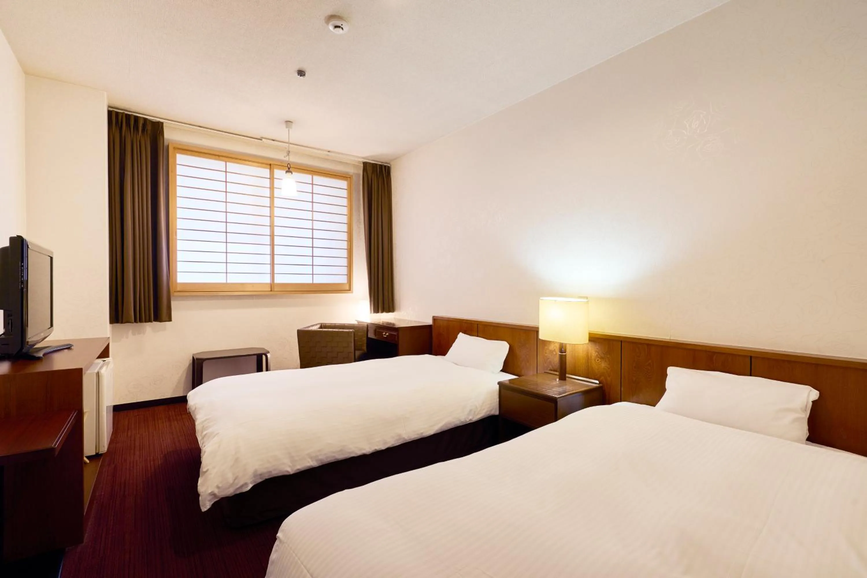 Bed in Hotel Flags Kuju Kusima