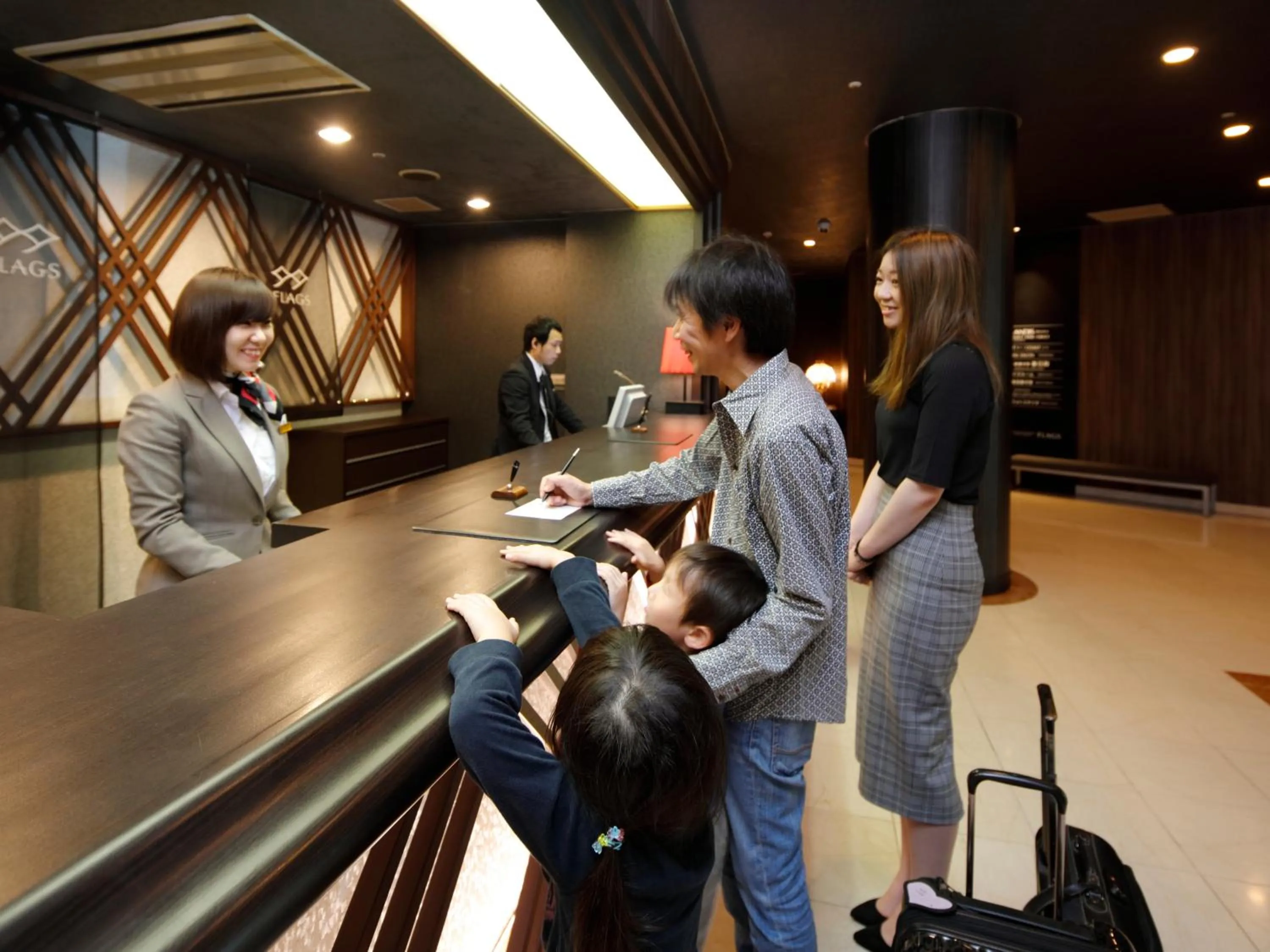 Staff in Hotel Flags Kuju Kusima