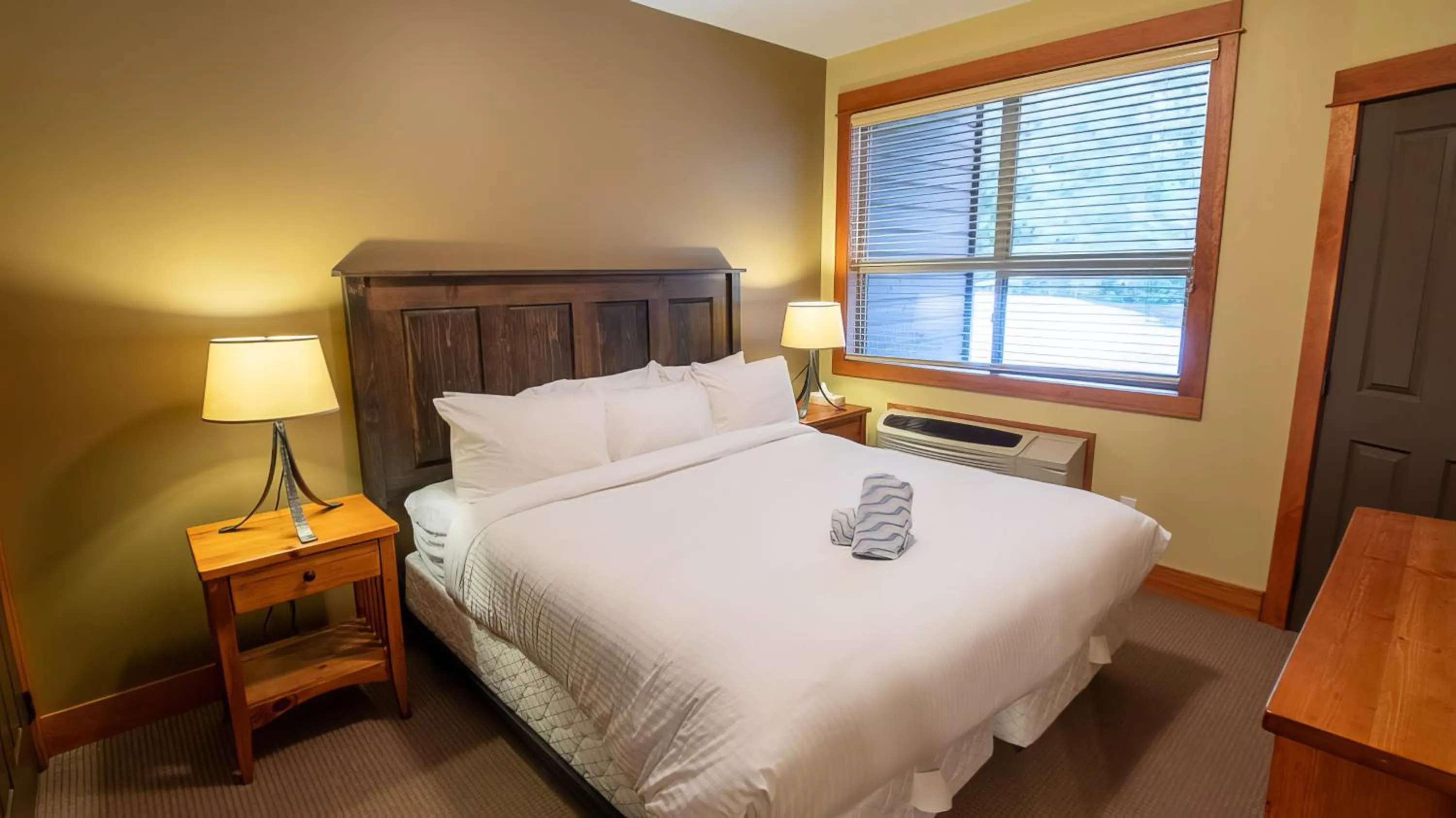 Bed in Timberline Lodges by Fernie Lodging Co