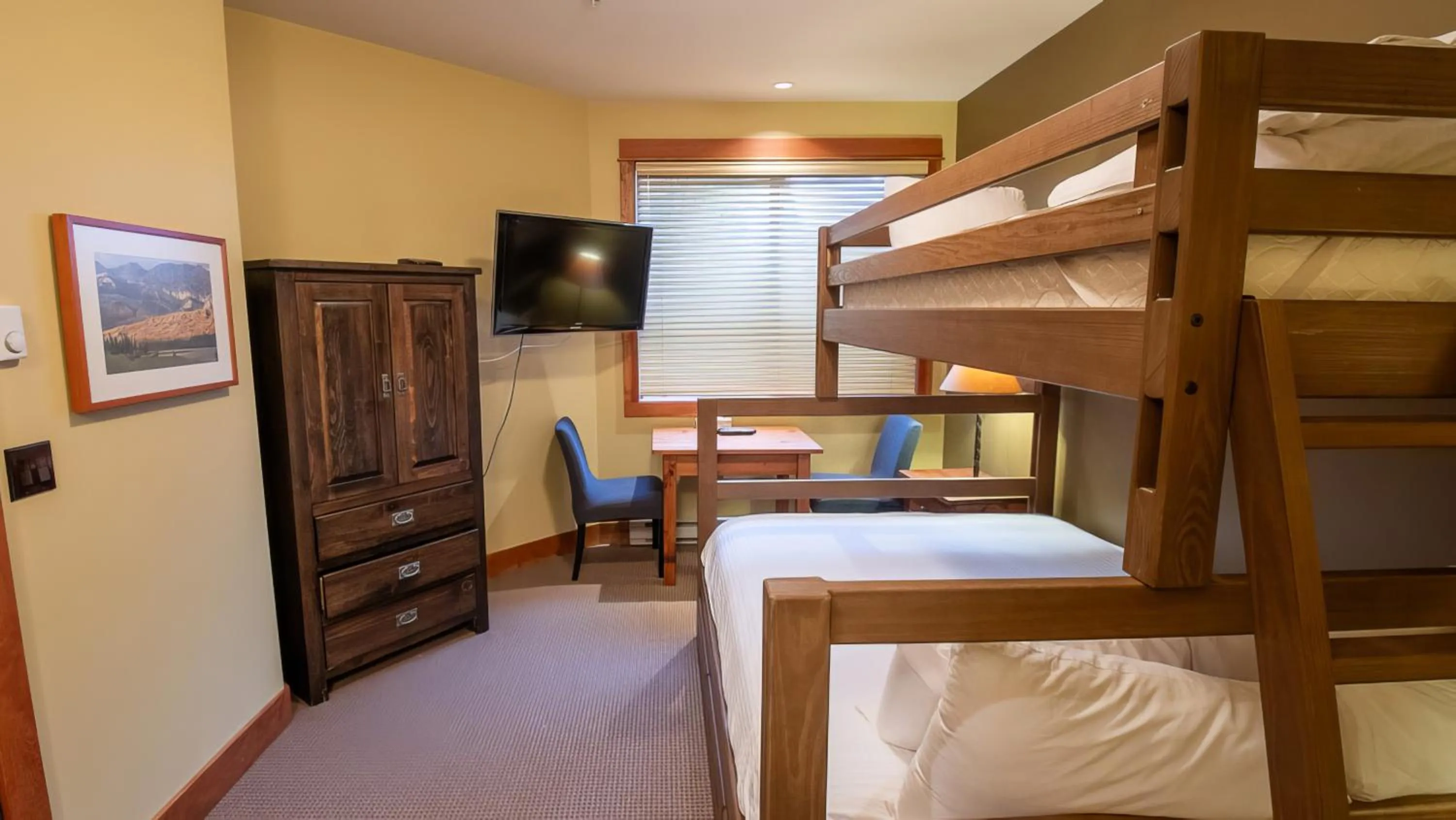 Bed in Timberline Lodges by Fernie Lodging Co