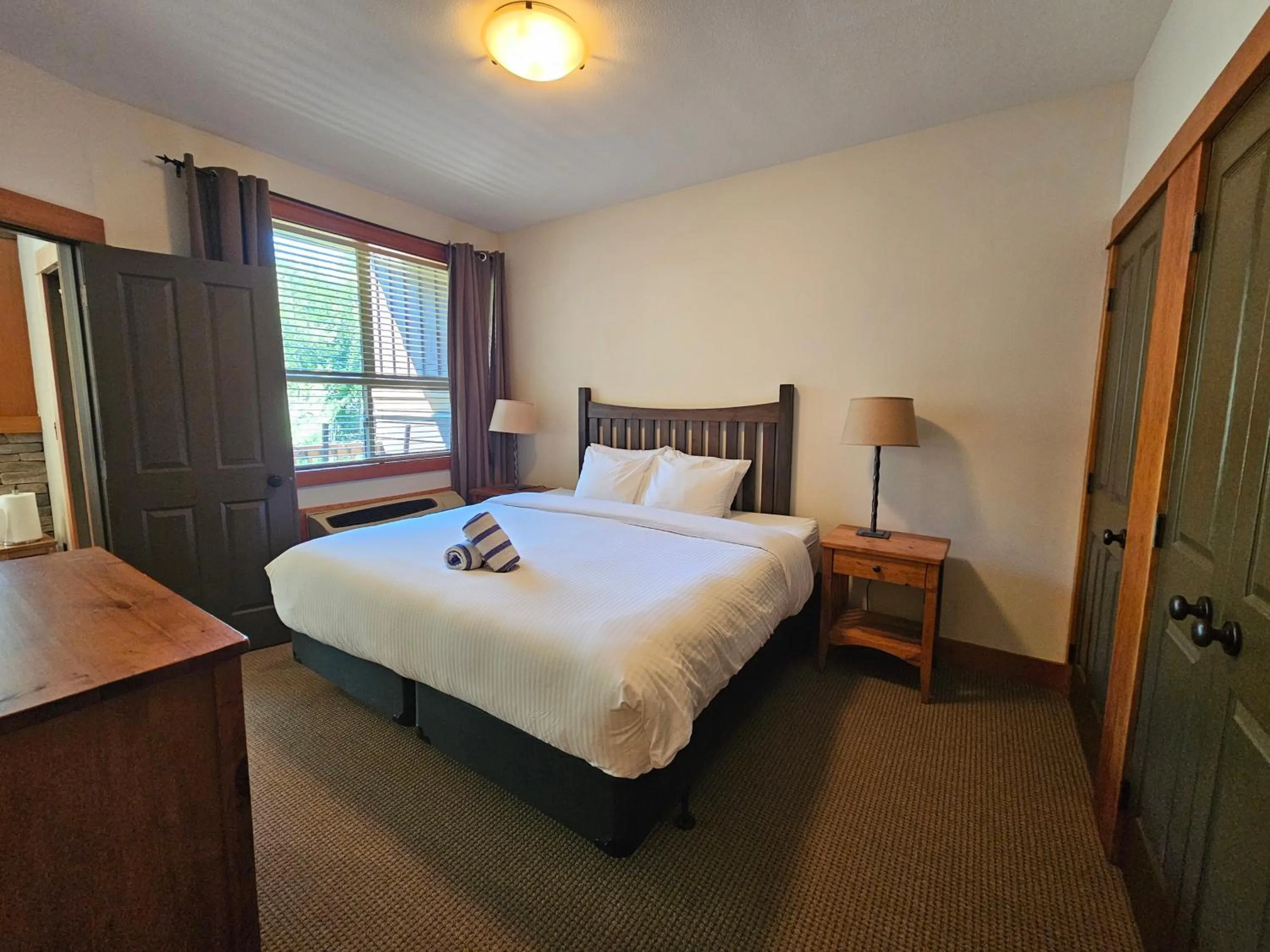 Bed in Timberline Lodges by Fernie Lodging Co