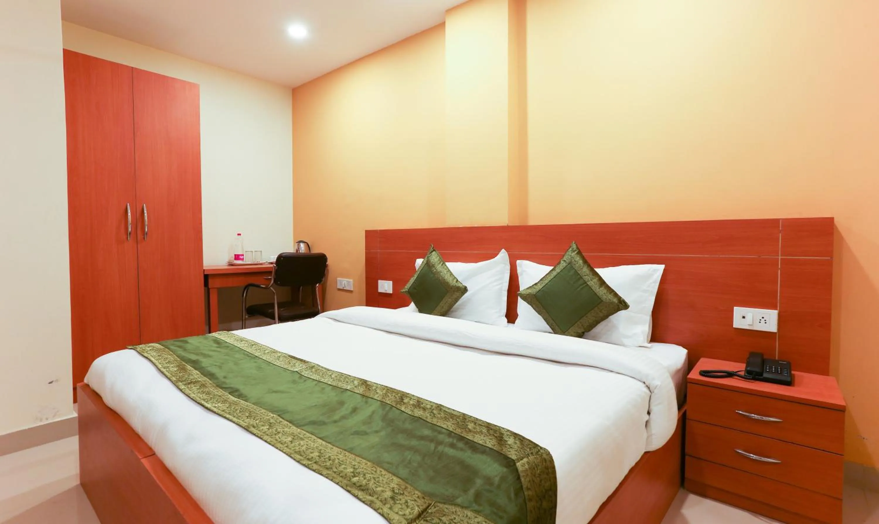 Bed in Hotel TMS Residency