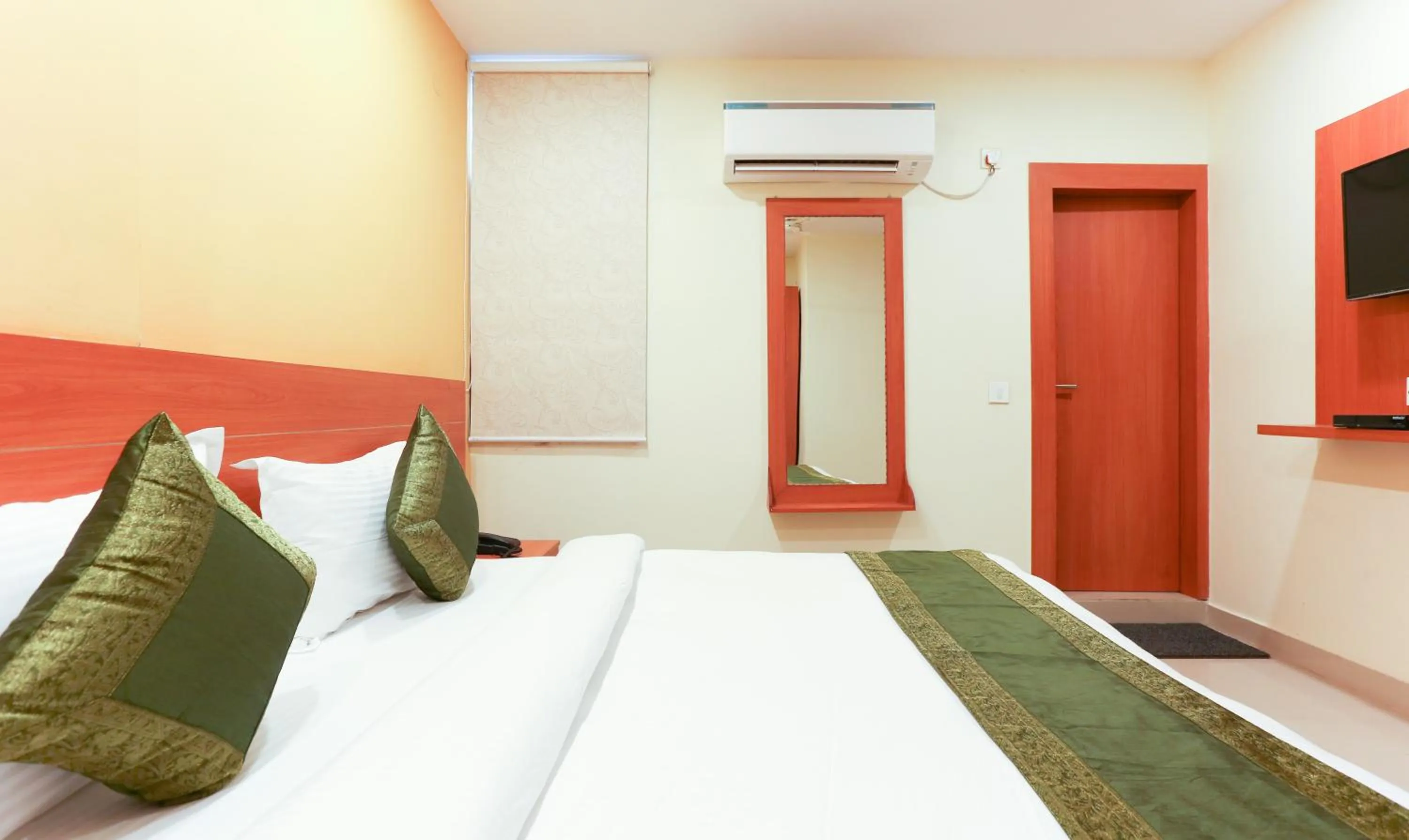 Bed in Hotel TMS Residency