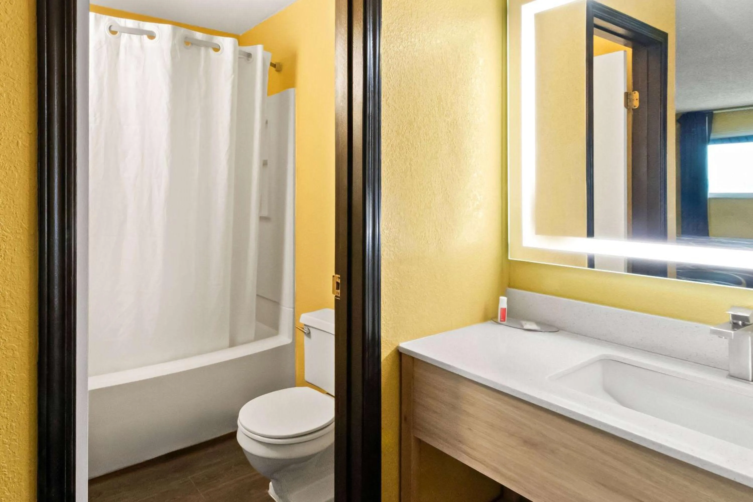 Bathroom in Super 8 by Wyndham Vandalia/Dayton International Airport