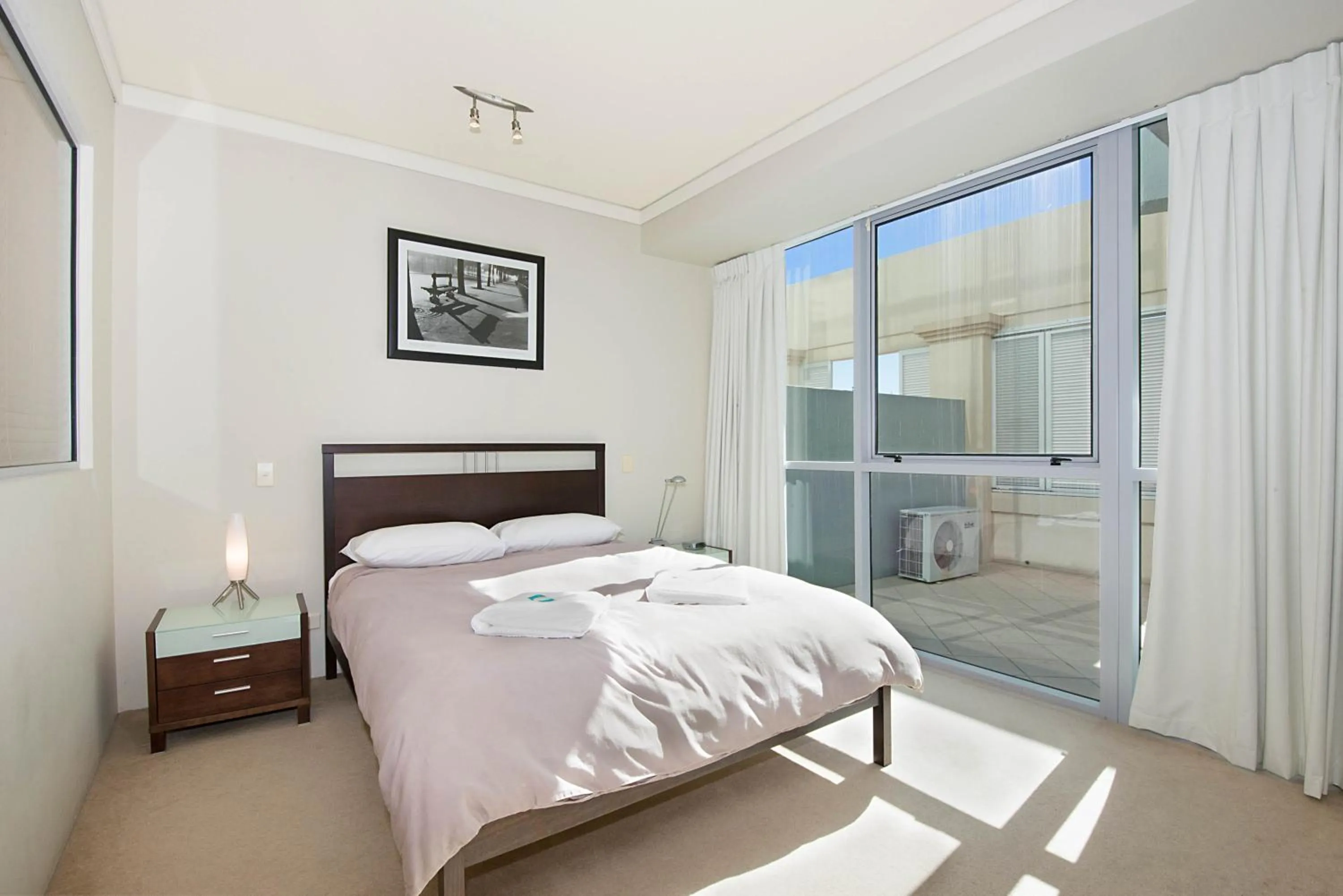 Bed in The Grand Apartments