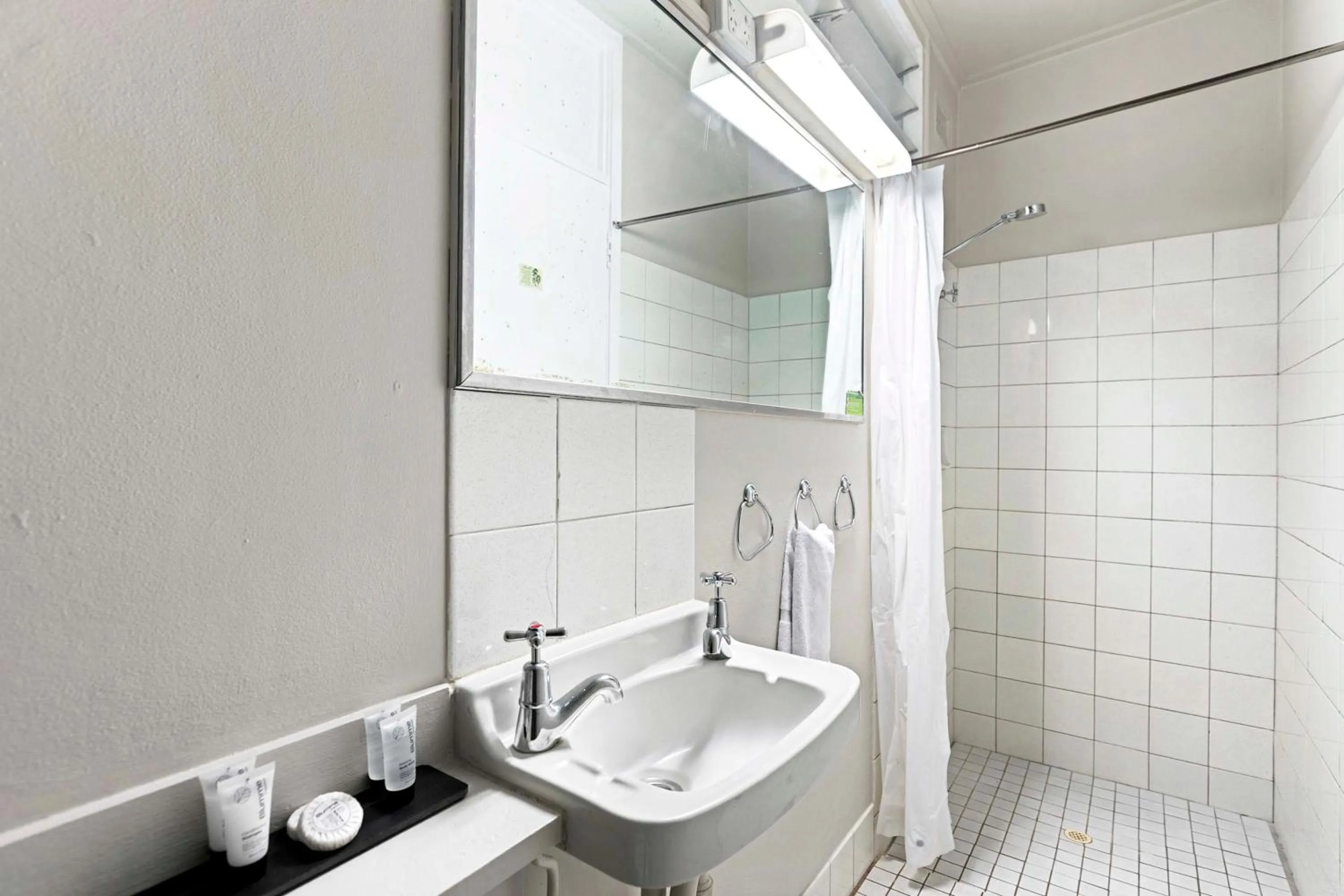 Bathroom in Arkana Motel Maryborough, SureStay Collection by Best Western