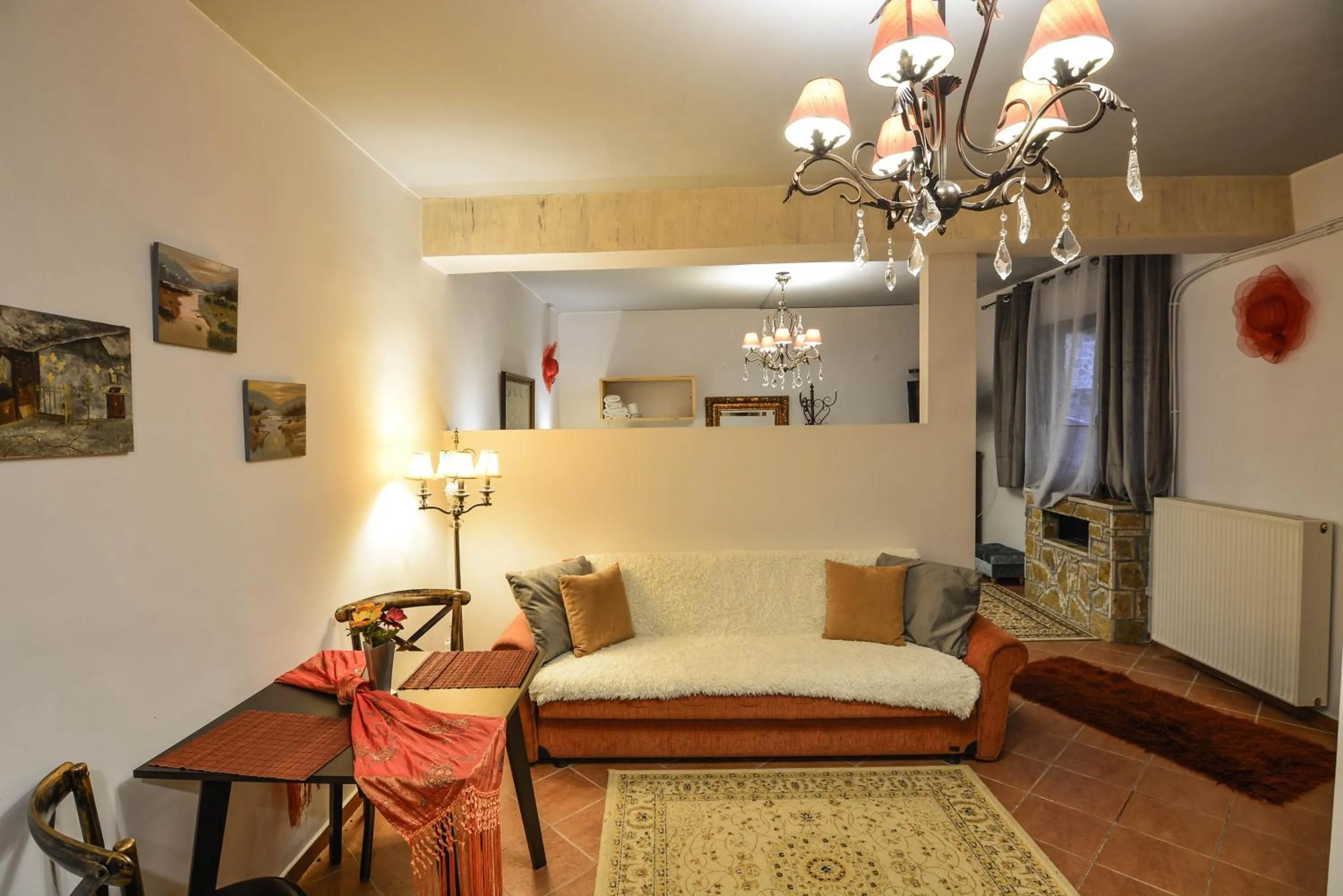 Seating area, Bed in Trikalon Muses Art Suites