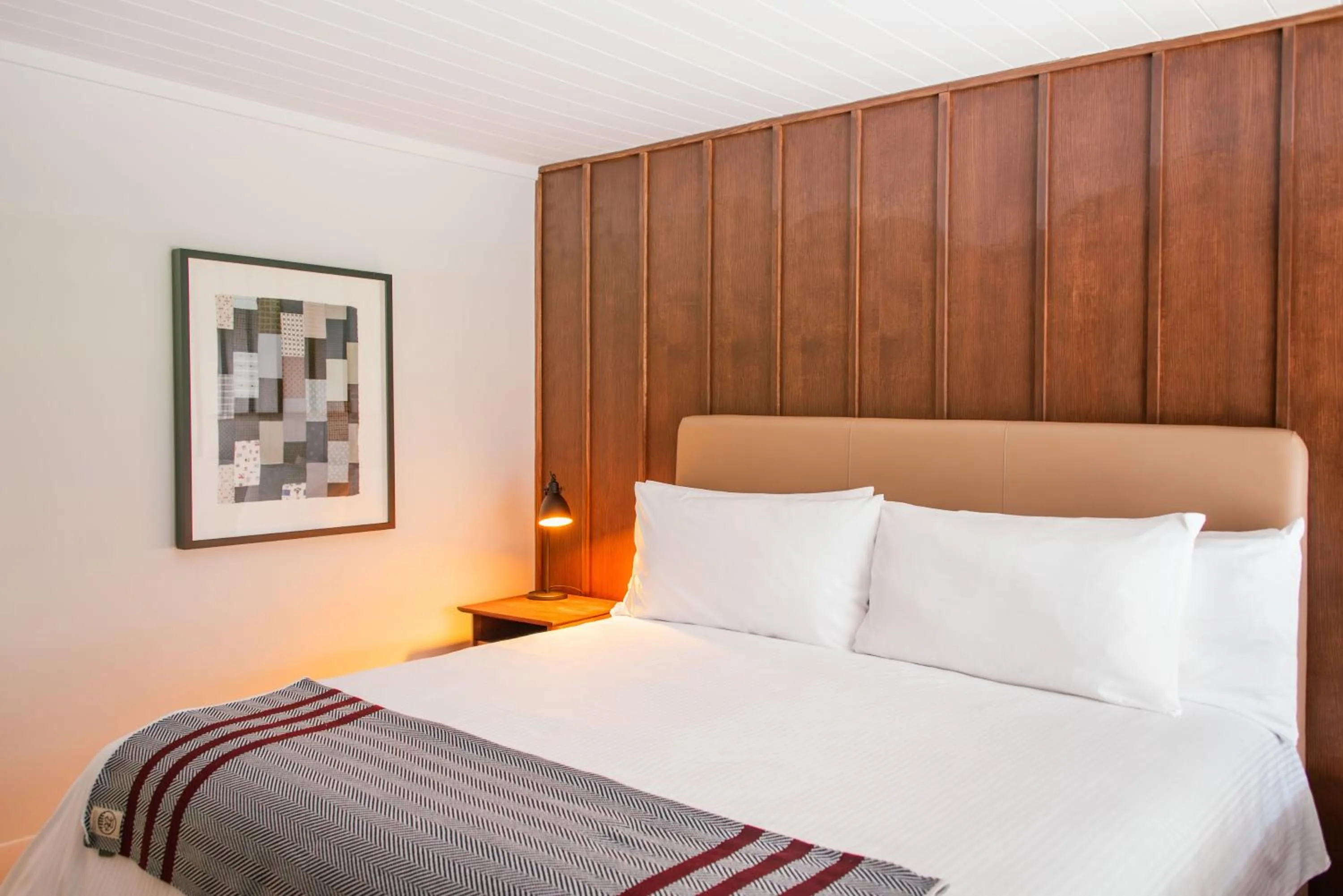 Bed in Historic Rocky Waters Inn, A Small Luxury Hotel