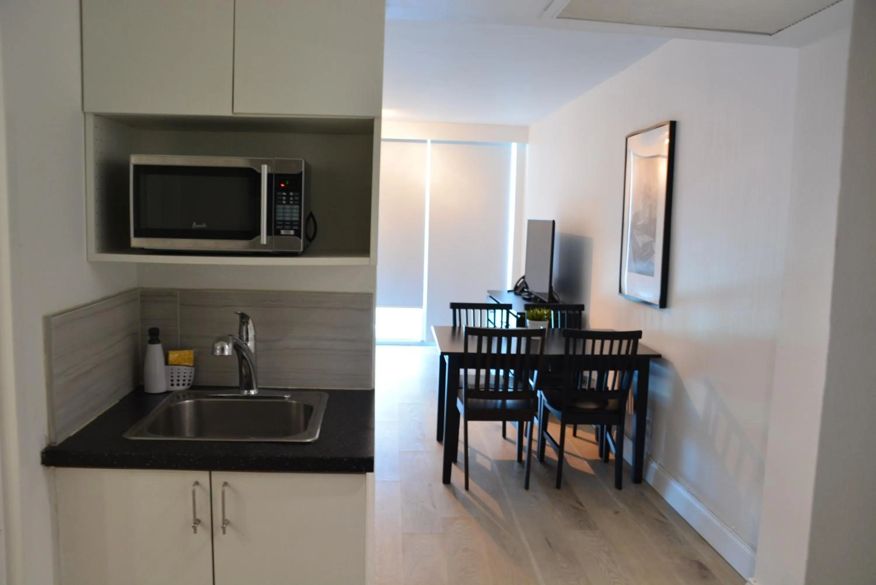 Kitchen or kitchenette in New Point Miami Beach Apartments