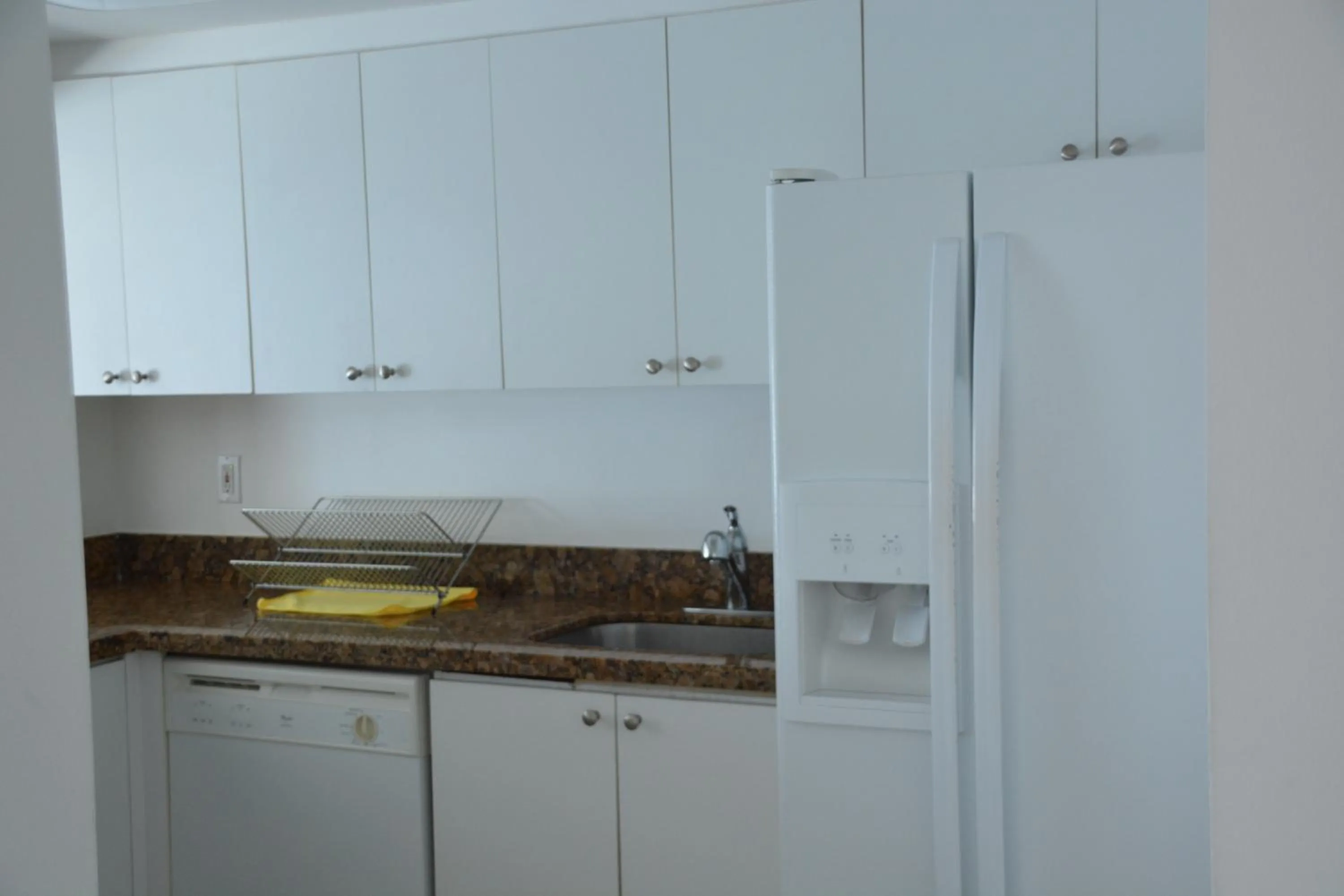 Kitchen or kitchenette in New Point Miami Beach Apartments