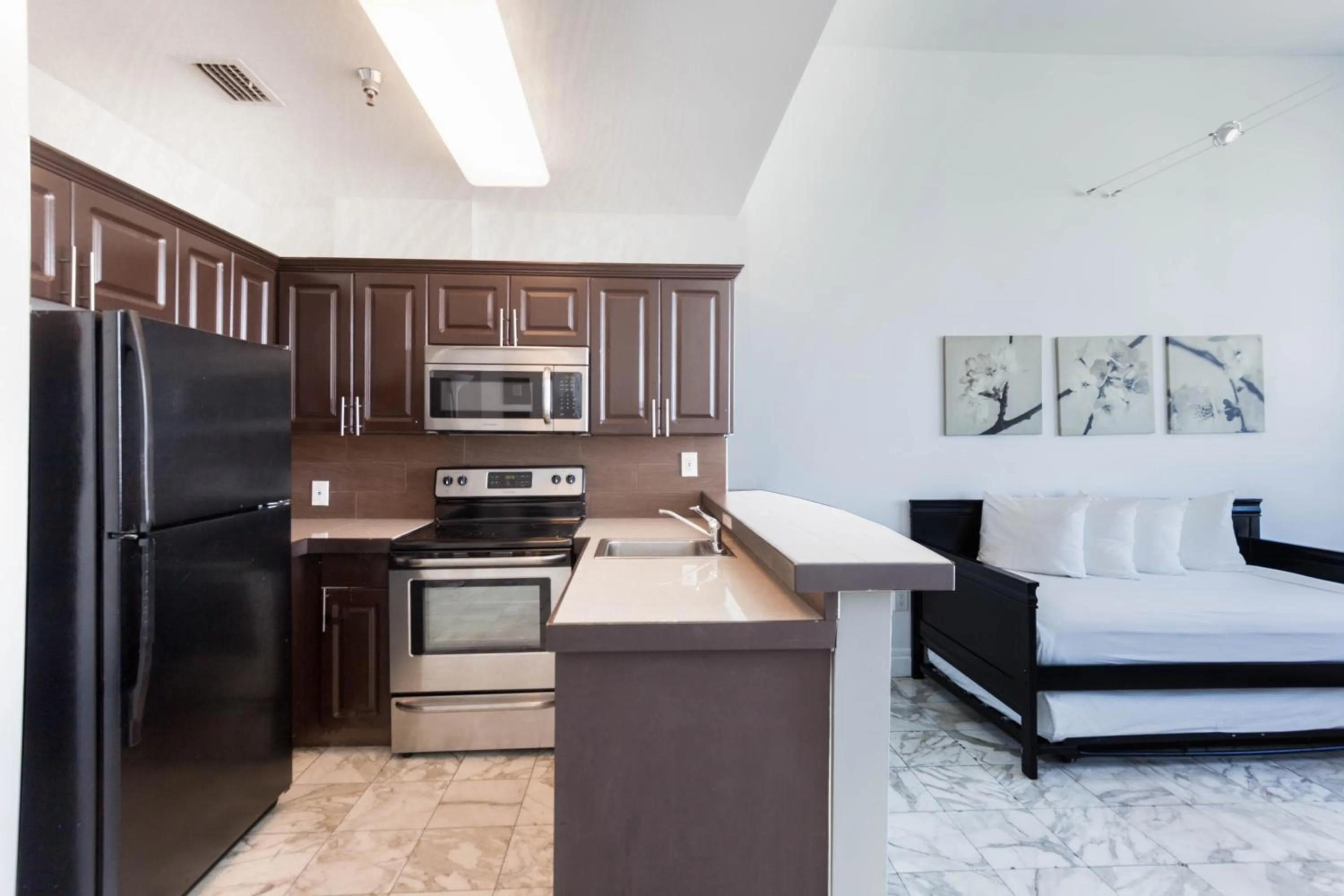 Kitchen or kitchenette in New Point Miami Beach Apartments