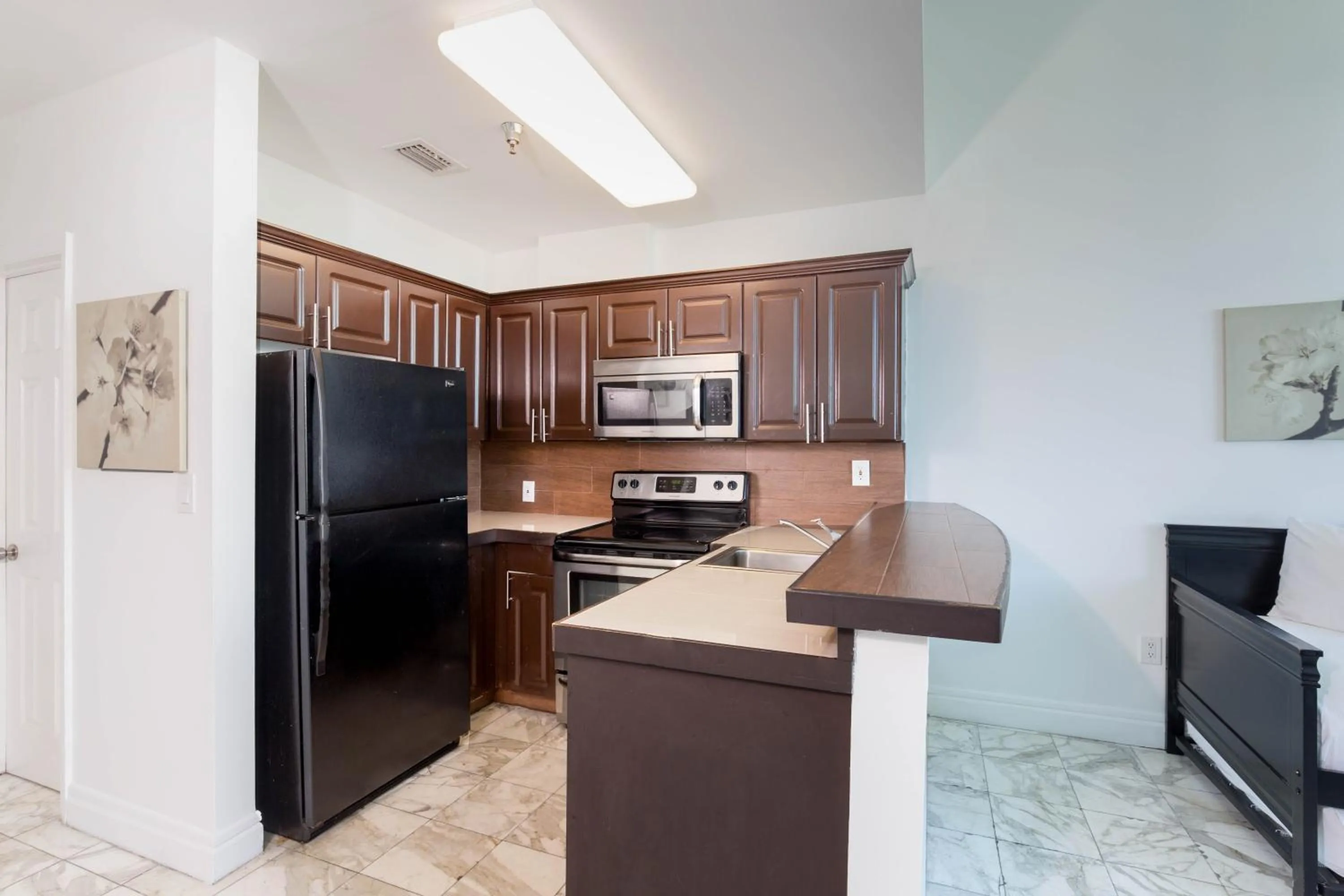 Kitchen or kitchenette in New Point Miami Beach Apartments