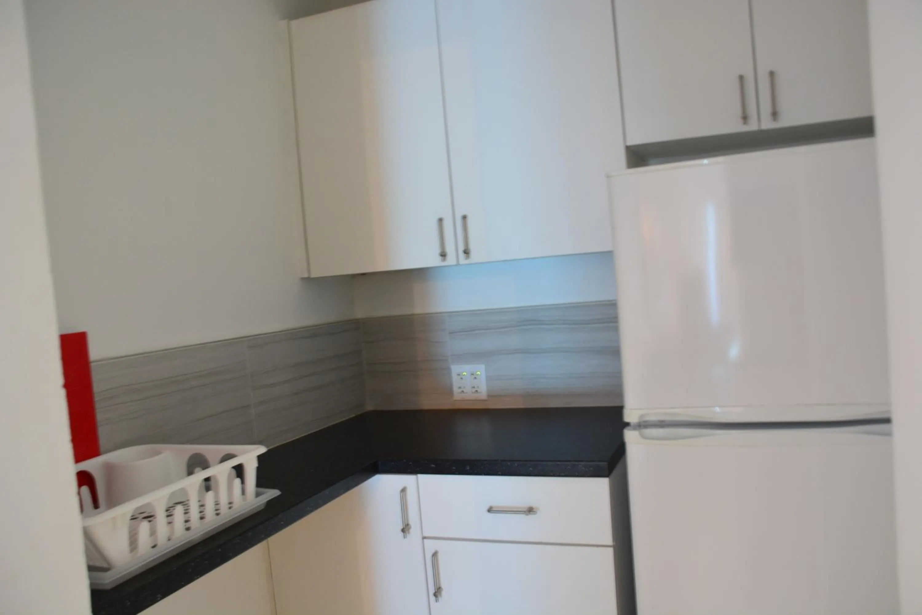 Kitchen or kitchenette in New Point Miami Beach Apartments