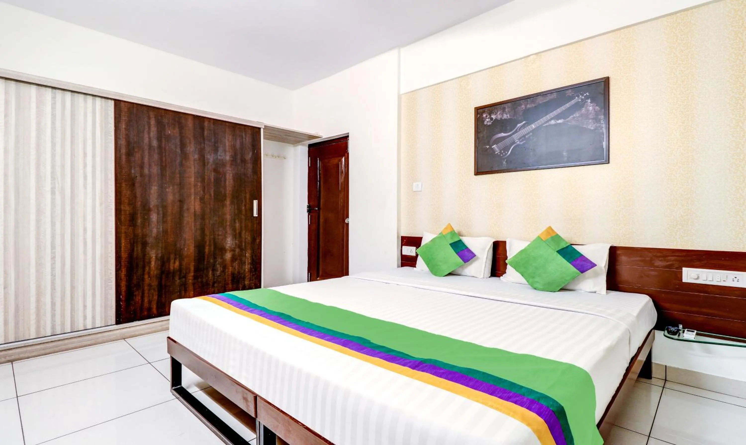 Bedroom, Bed in Treebo Saga Apartment