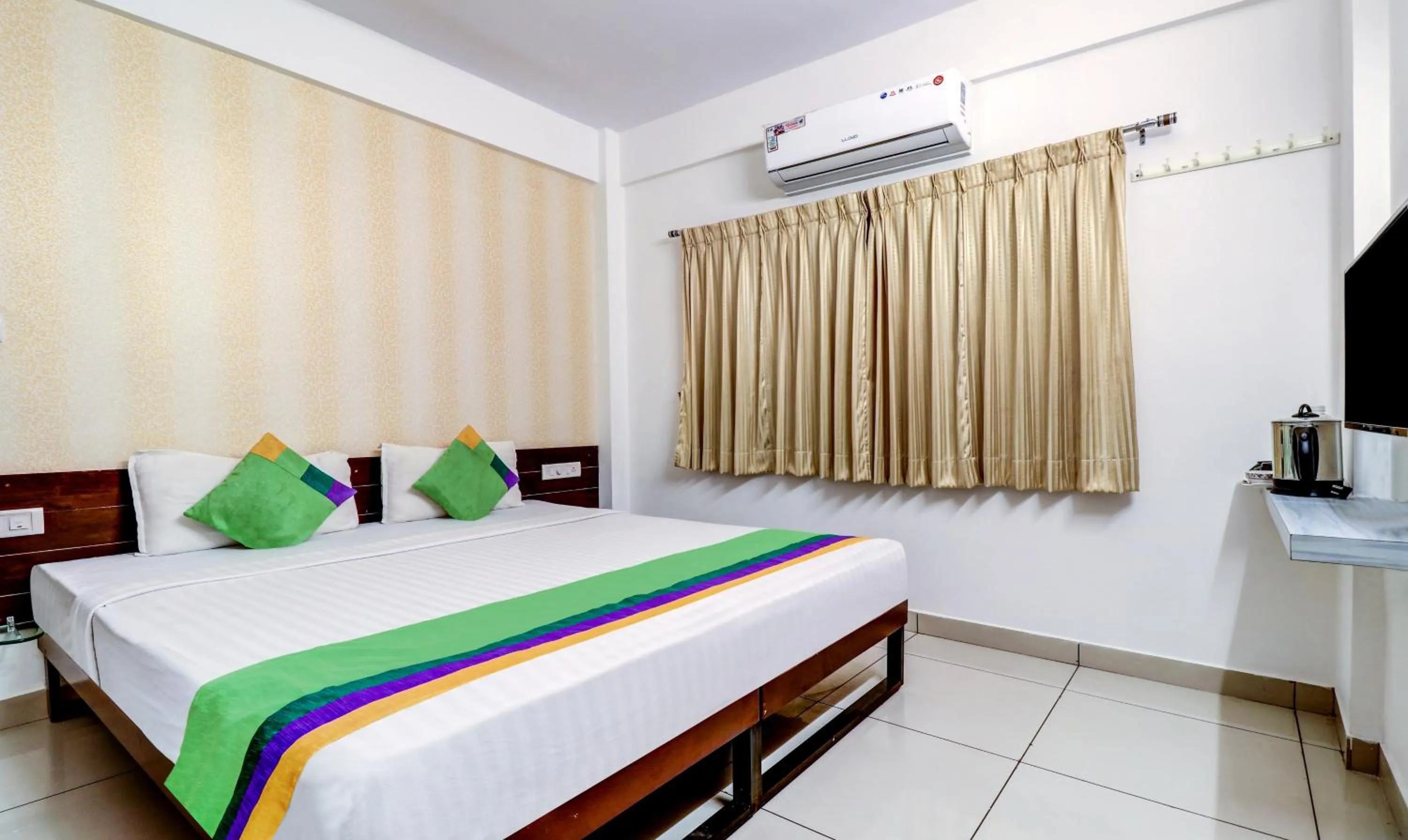 Bedroom, Bed in Treebo Saga Apartment