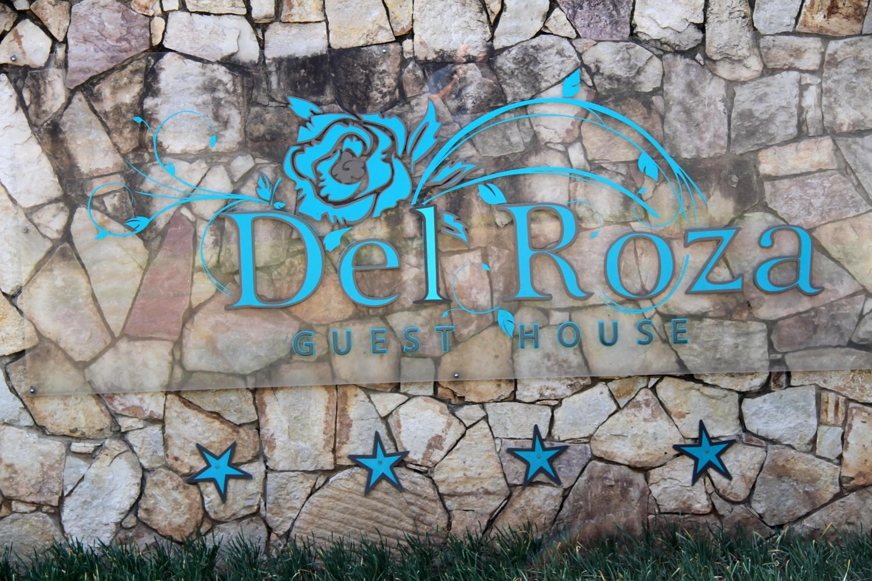 Property logo or sign in Del Roza Guest House