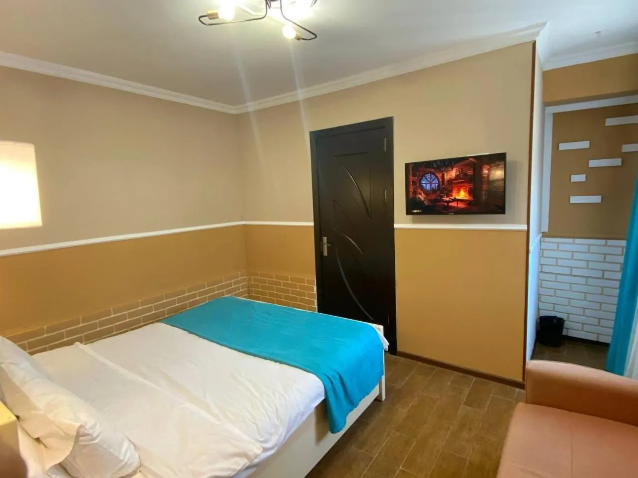 Communal lounge/ TV room, Bed in Hotel Orange Kutaisi