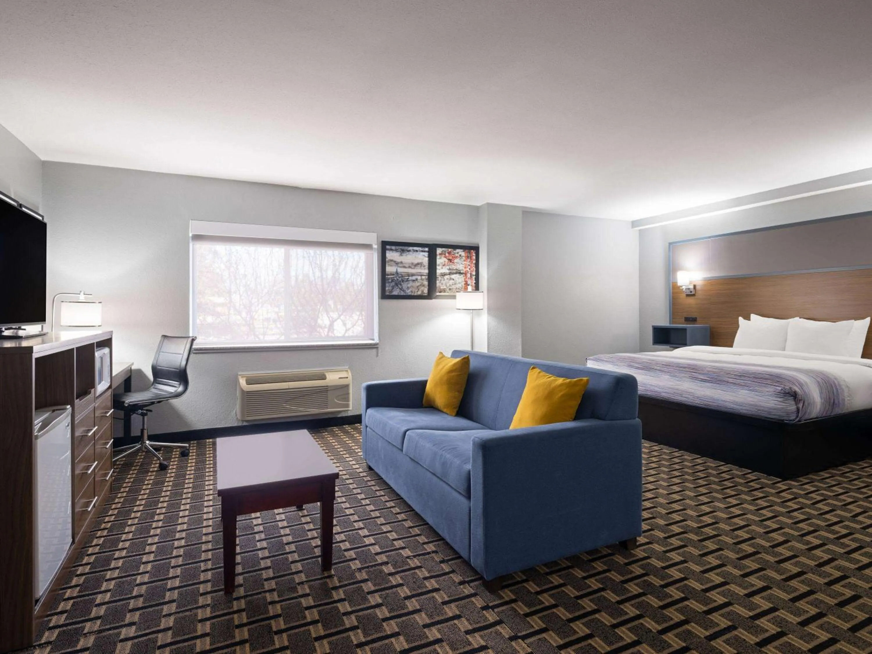 Photo of the whole room, Bed in AmericInn by Wyndham Woodstock IL