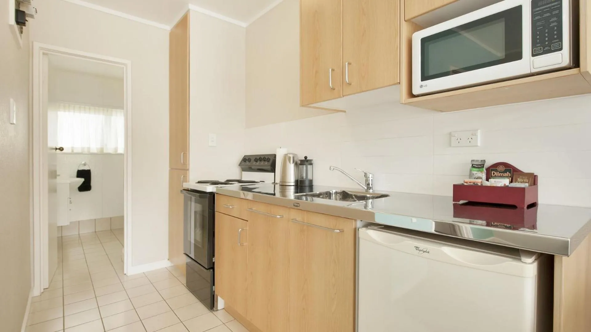 Kitchen or kitchenette in Hananui Lodge and Apartments