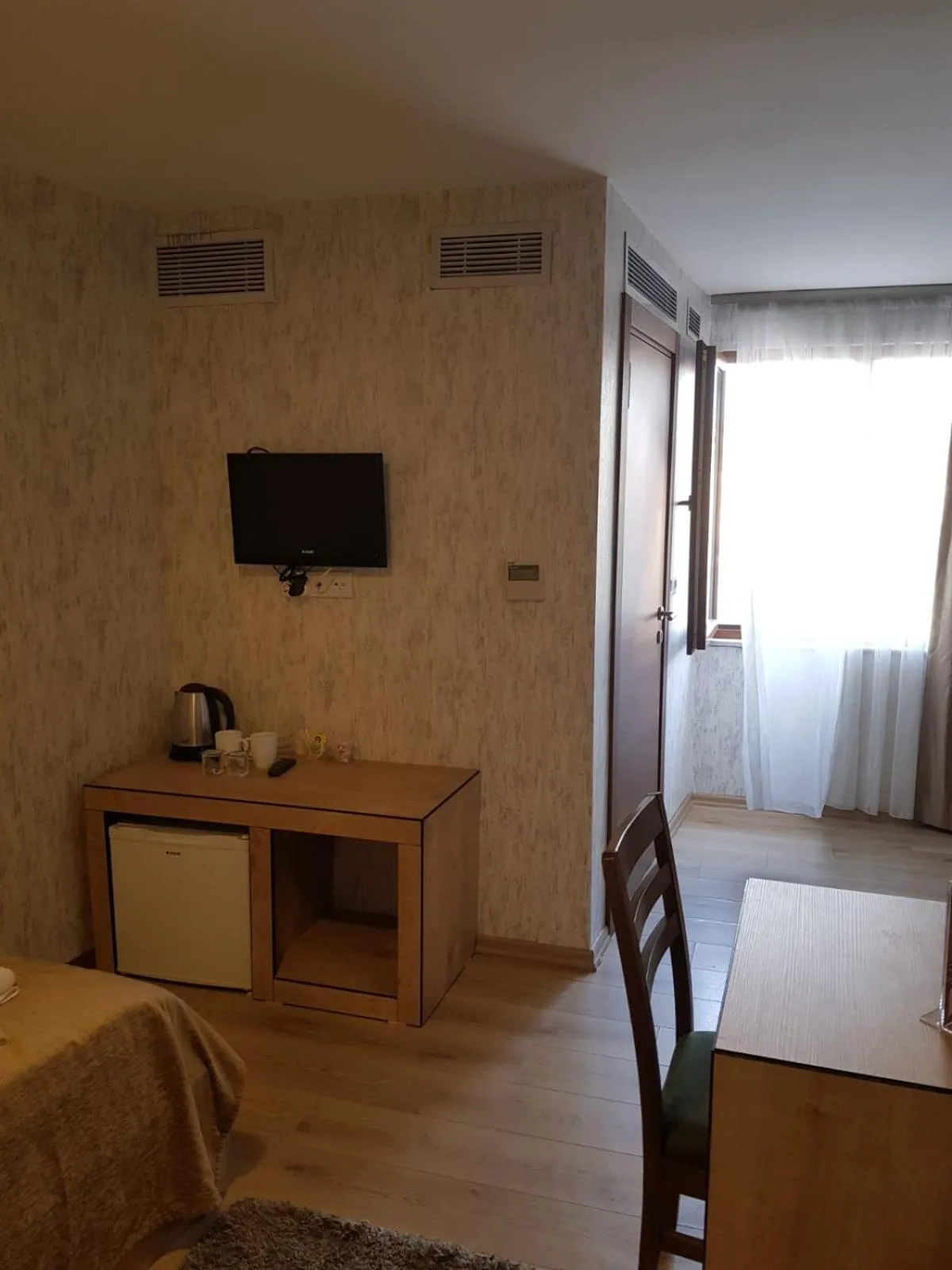 Communal lounge/ TV room in Double DD Hotel