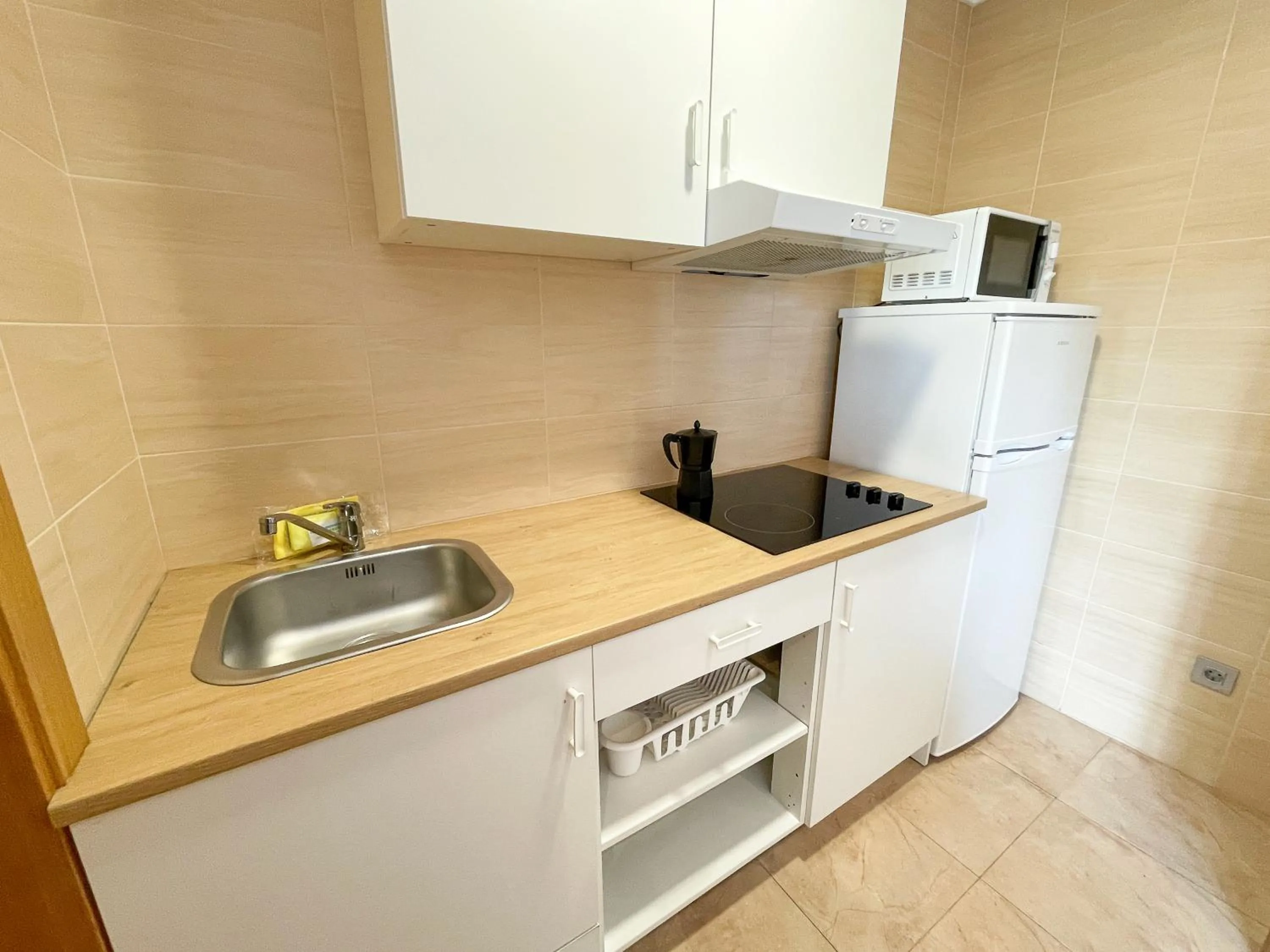 Kitchen or kitchenette in Apartamentos Revolta Sanxenxo 3000