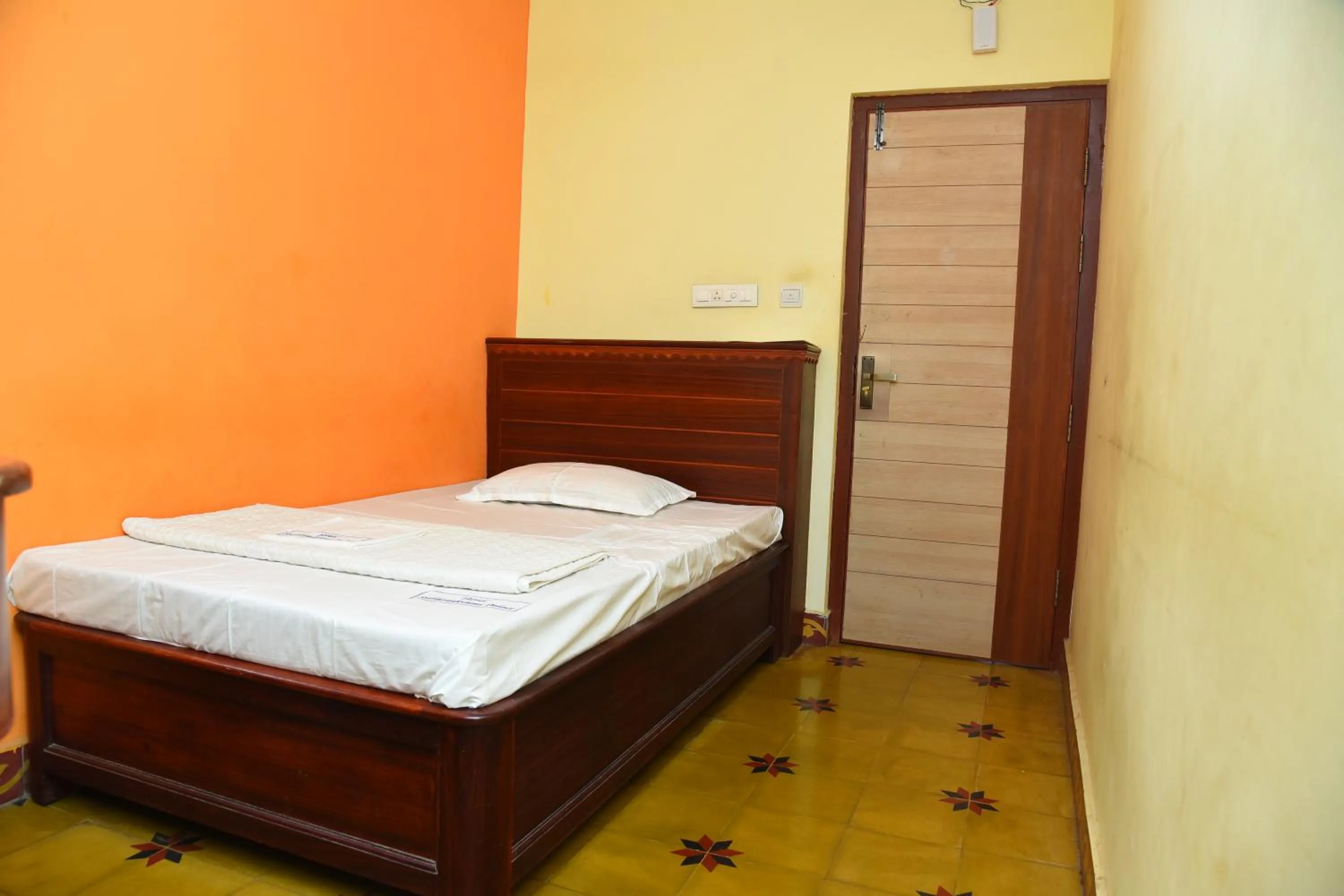 Bed in Hotel Subhalakshmi Palace