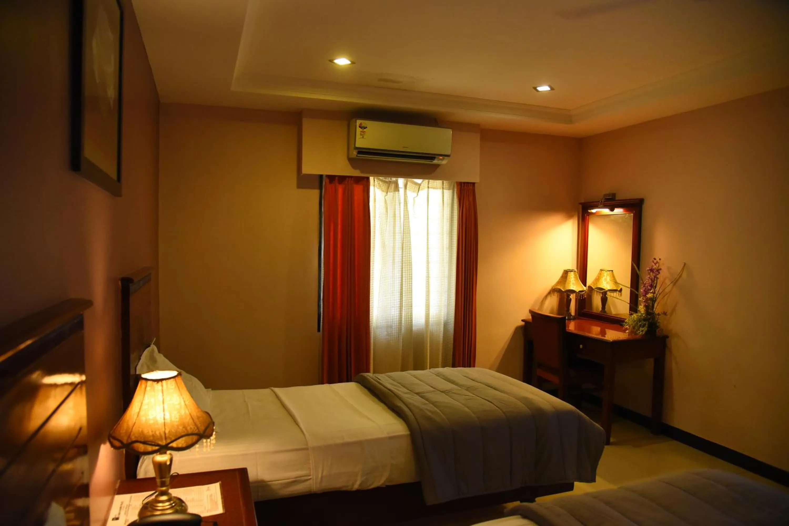 Bed in Hotel Subhalakshmi Palace