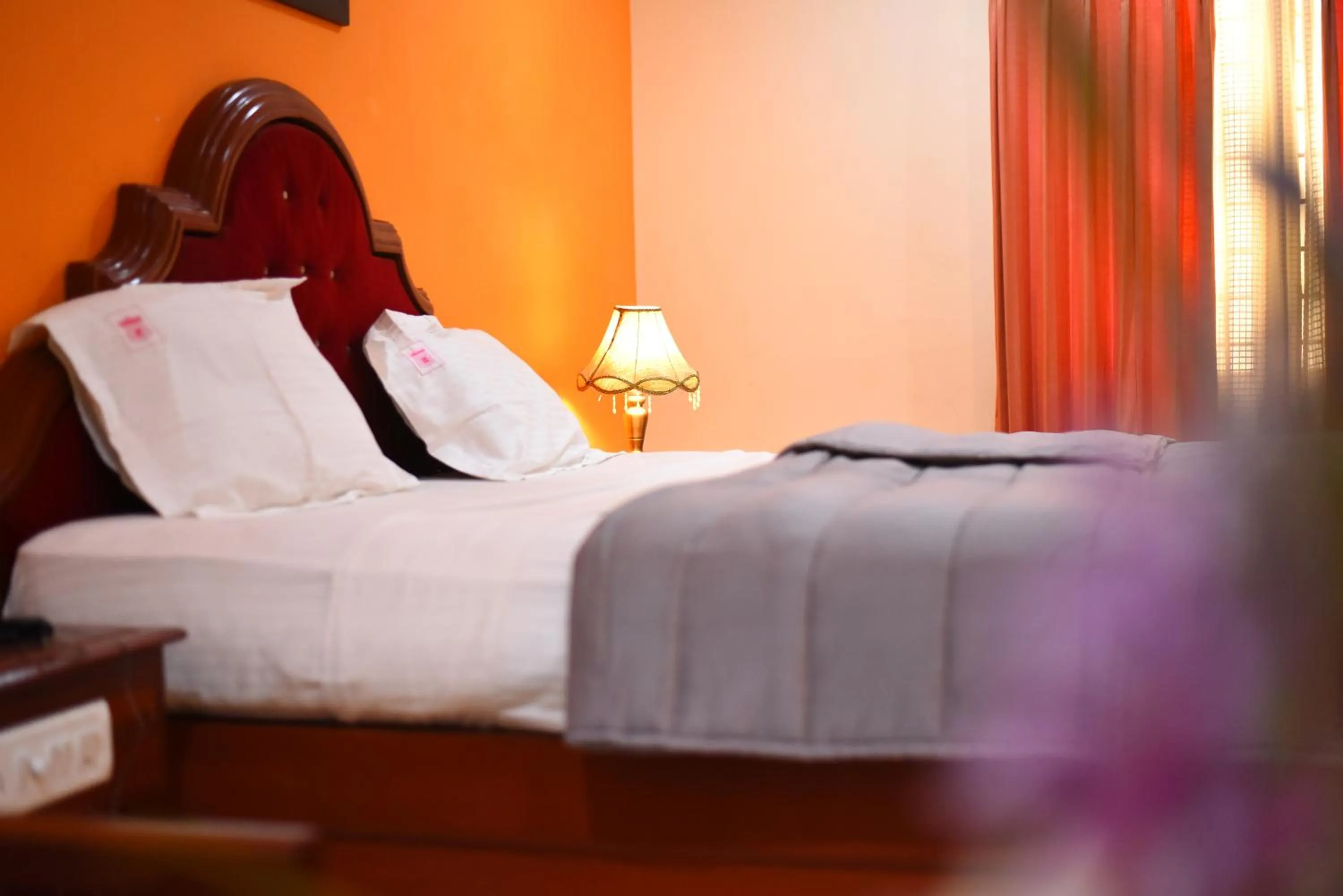 Bed in Hotel Subhalakshmi Palace