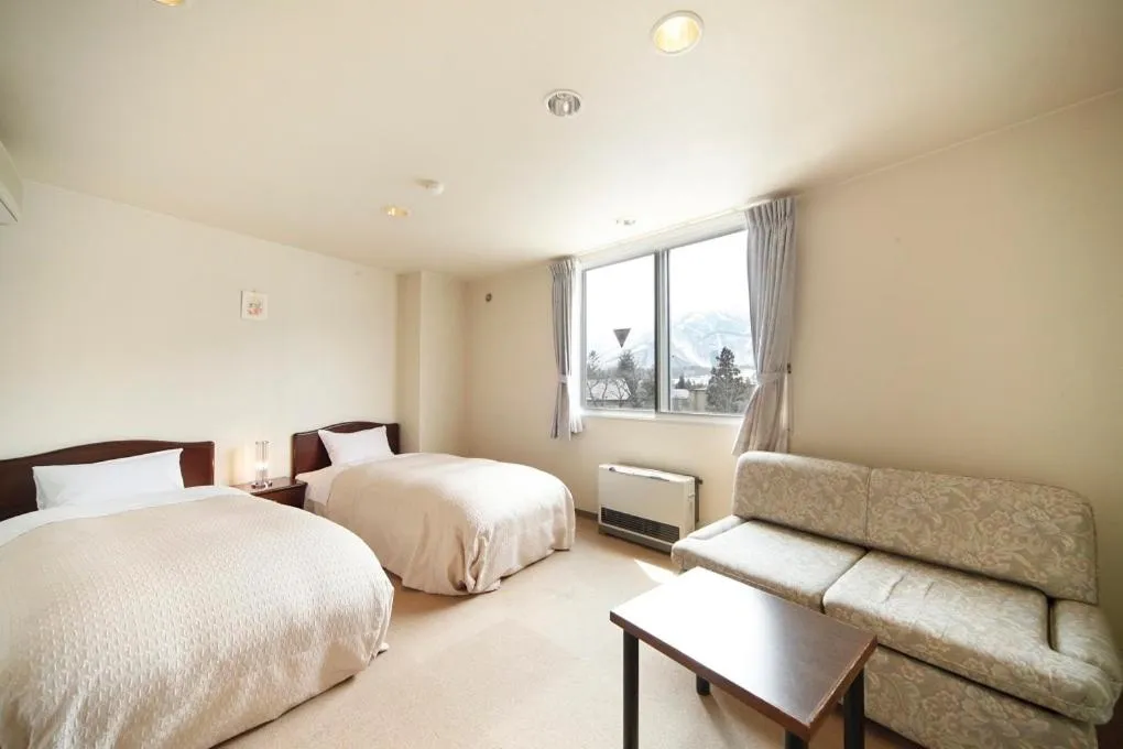 Bed in HOTEL 24sweets HAKUBA