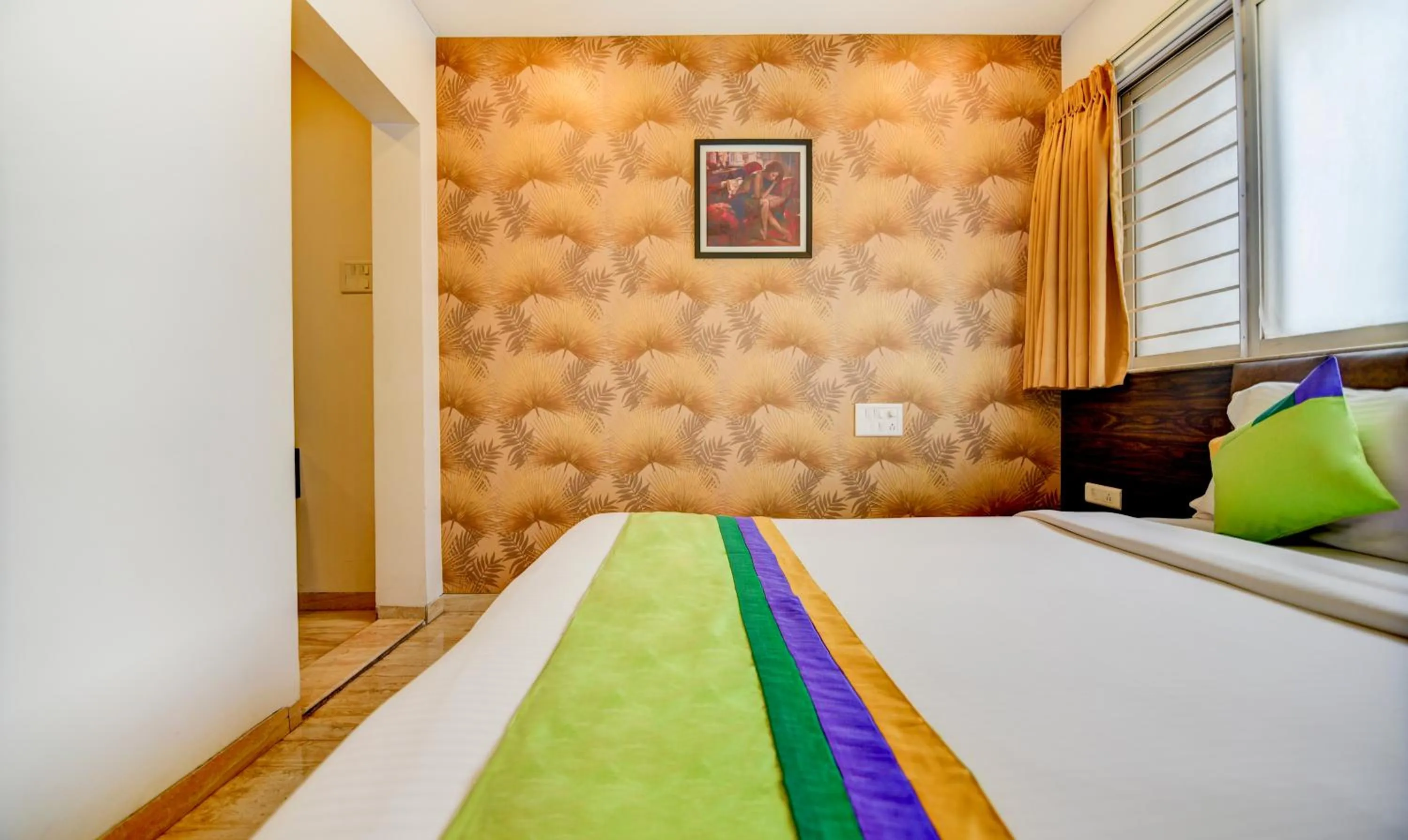 Bed in Treebo Kuval Inn