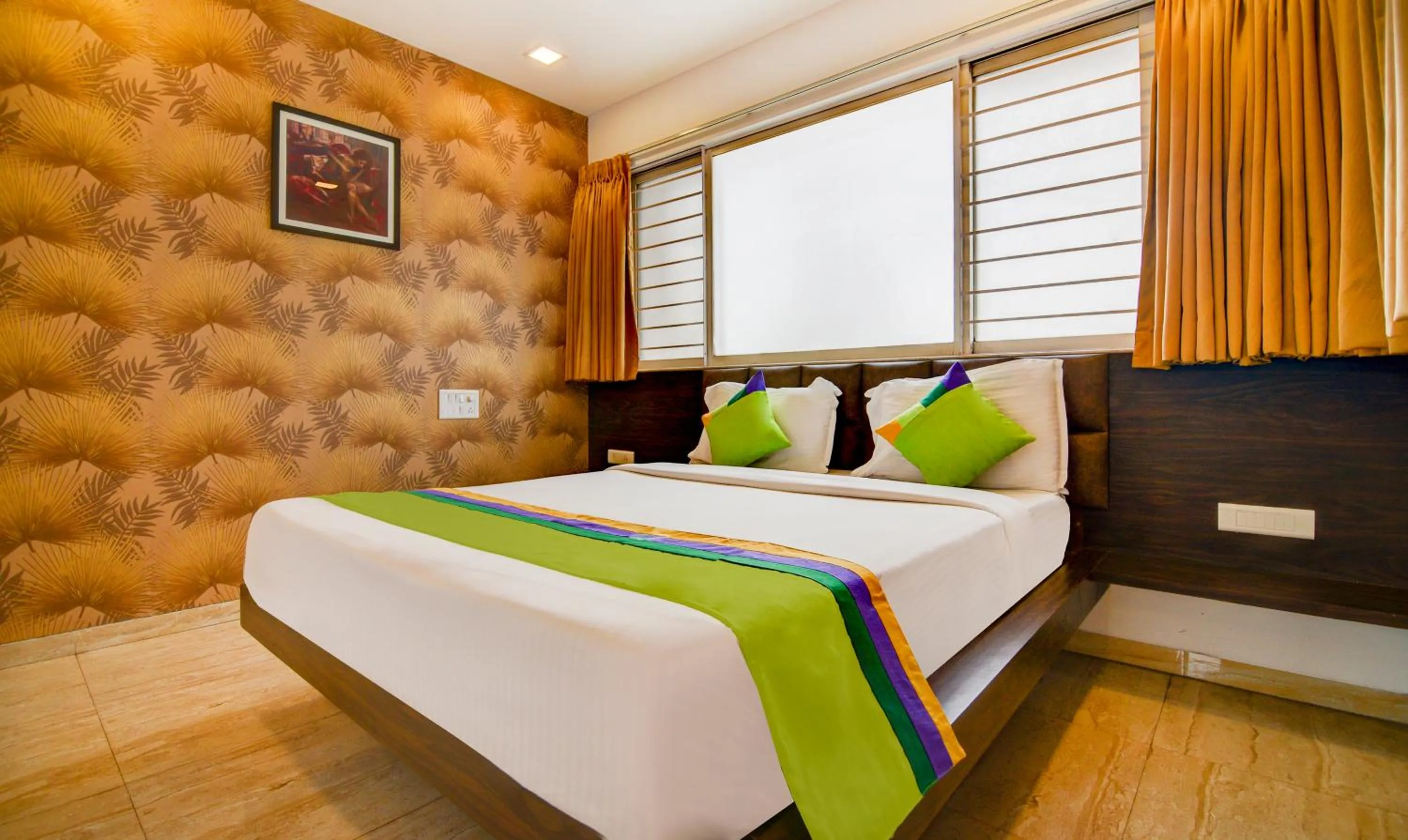 Bed in Treebo Kuval Inn