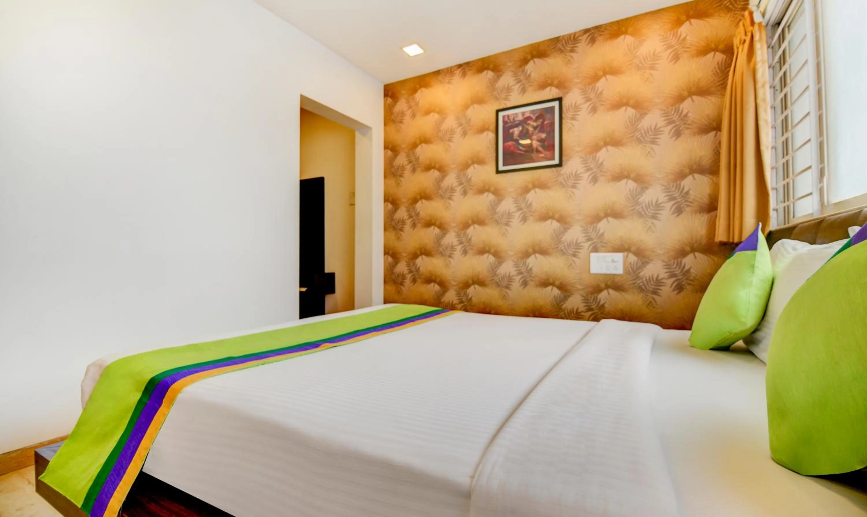 Bed in Treebo Kuval Inn