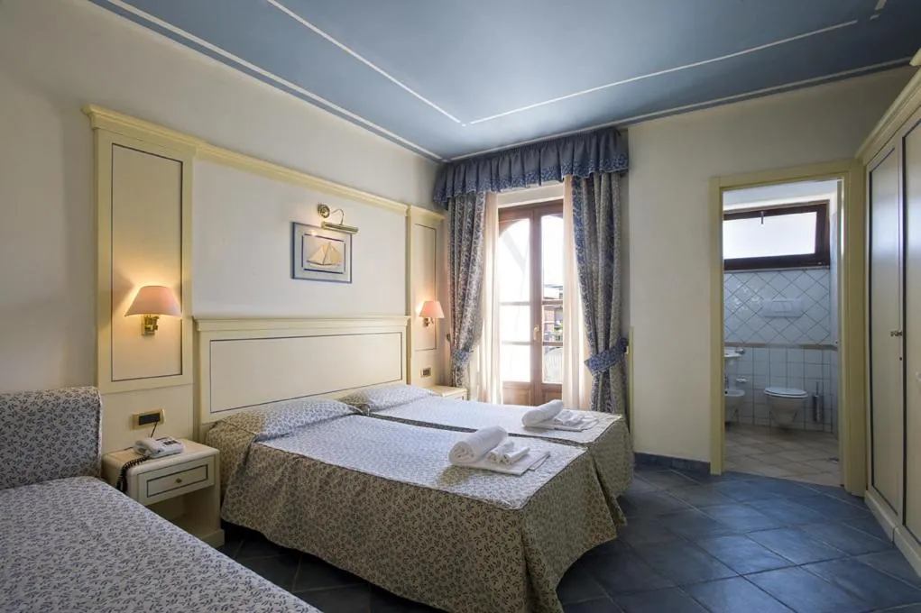 Bed in Hotel Poseidon