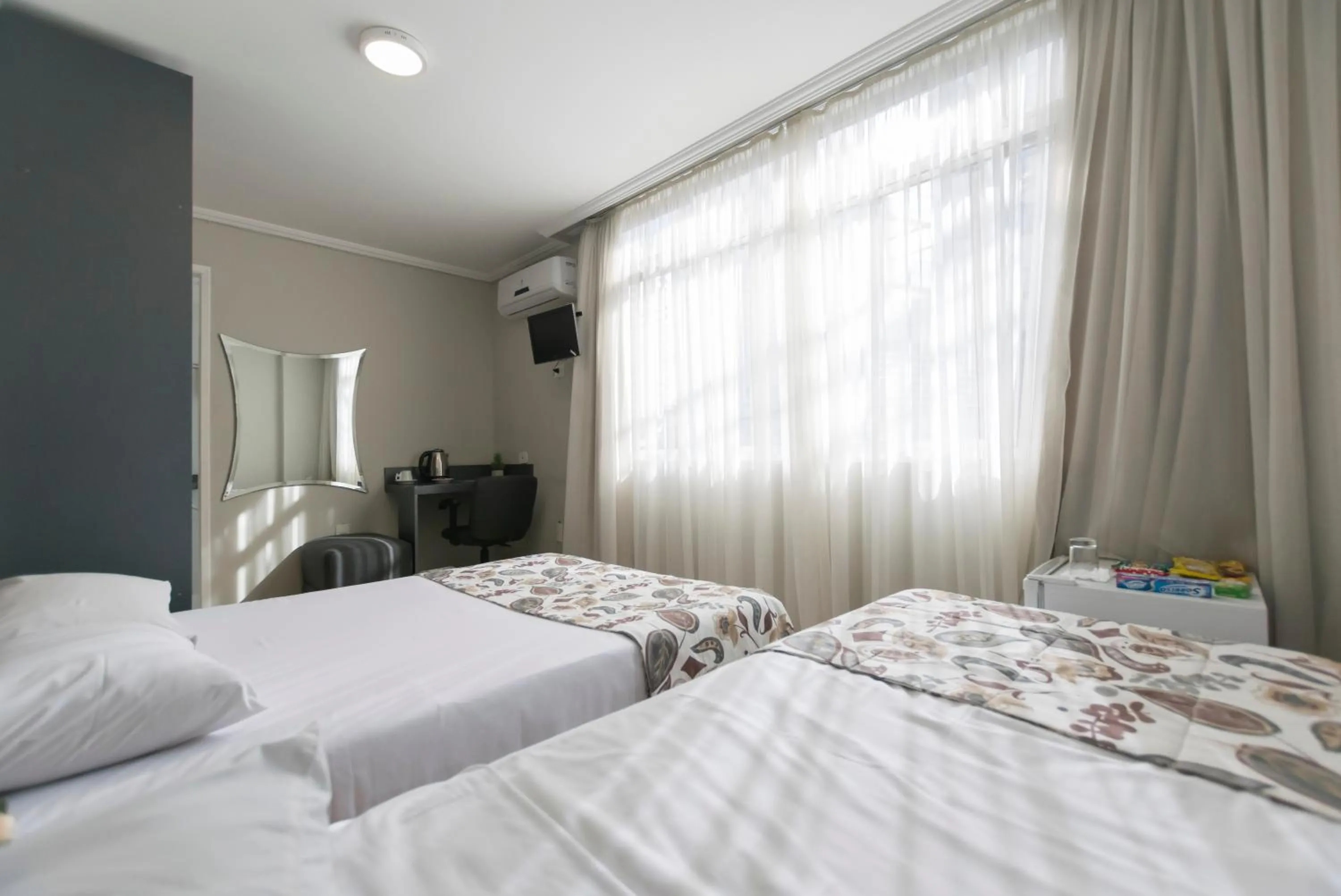 Bed in Paulista Garden Hotel