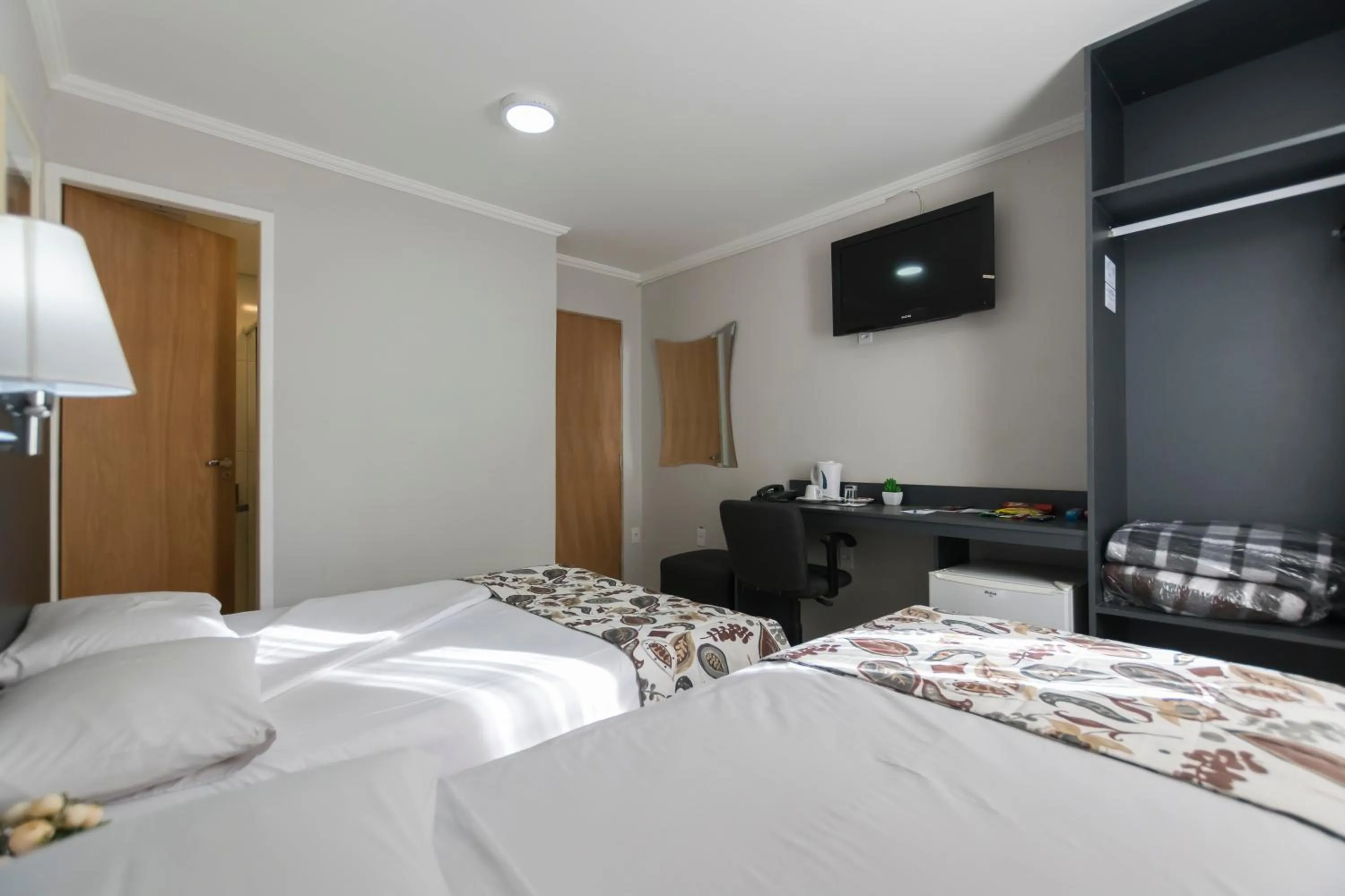 Bed in Paulista Garden Hotel